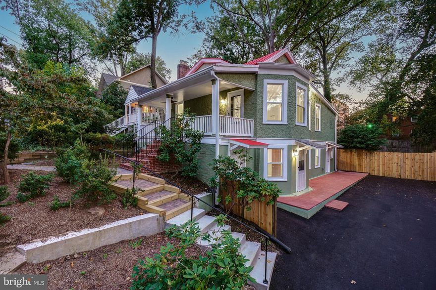 Welcome to this renovated bungalow with a delightful front porch, taking in tree-top views on one of vibrant Takoma Park's friendliest blocks! This incredible home offers superb architectural details, wood-grain porcelain tile flooring, Kichler ceiling fans, intricate crown molding, beautifully renovated bathrooms, two separate gorgeous quartz kitchens, all new windows, and a remarkable perch and porch! Enter via the light-filled living room with recessed lighting and “wood style” porcelain tile flooring. The living room opens to the sun-drenched dining room with a drum chandelier. The brand-new open chef’s kitchen offers a Samsung stainless steel appliance suite, gas cooking, exquisite quartz counters, gorgeous floor to ceiling oak cabinetry, a breakfast bar with backyard views, and access to the rear deck.  The main level is complete with two bedrooms, and two renovated spa bathrooms, including the primary bedroom suite with a designer ceiling fan, a mirrored wall closet, and a luxurious private bathroom. Off the dining room are fixed stairs to the attic.

Downstairs offers a bright family room, a versatile bedroom / playroom with an exterior exit, a fourth bedroom, a renovated bathroom, and a 2nd quartz kitchen with access to the back deck and yard. This thoughtfully designed level could be utilized as an in-law suite / or a separate living space. 
The exterior includes a fenced yard with privacy fencing, a large deck with composite decking boards, a side brick patio, a covered front porch, and delightful brick paver pathways. This property is complete with a new driveway that can tandem park multiple cars (the backyard gate opens to accommodate additional parking).  Conveniently located on a quiet close-knit street with frequent neighborhood gatherings near the Takoma Park Community Center and Piney Branch Elementary School! 

The perfect location: close to Sligo Creek Park and the Takoma Park Library and Community Center. Just 0.7 miles to the Takoma Park Metro Station! Enjoy living in eclectic Takoma Park; the location offers all the allure and convenience of this very special area.  Relish the warm sense of community as well as ready access to shopping, restaurants, the farmer’s market, and entertainment in both Takoma Park and wonderful, vibrant downtown Silver Spring. See you there!