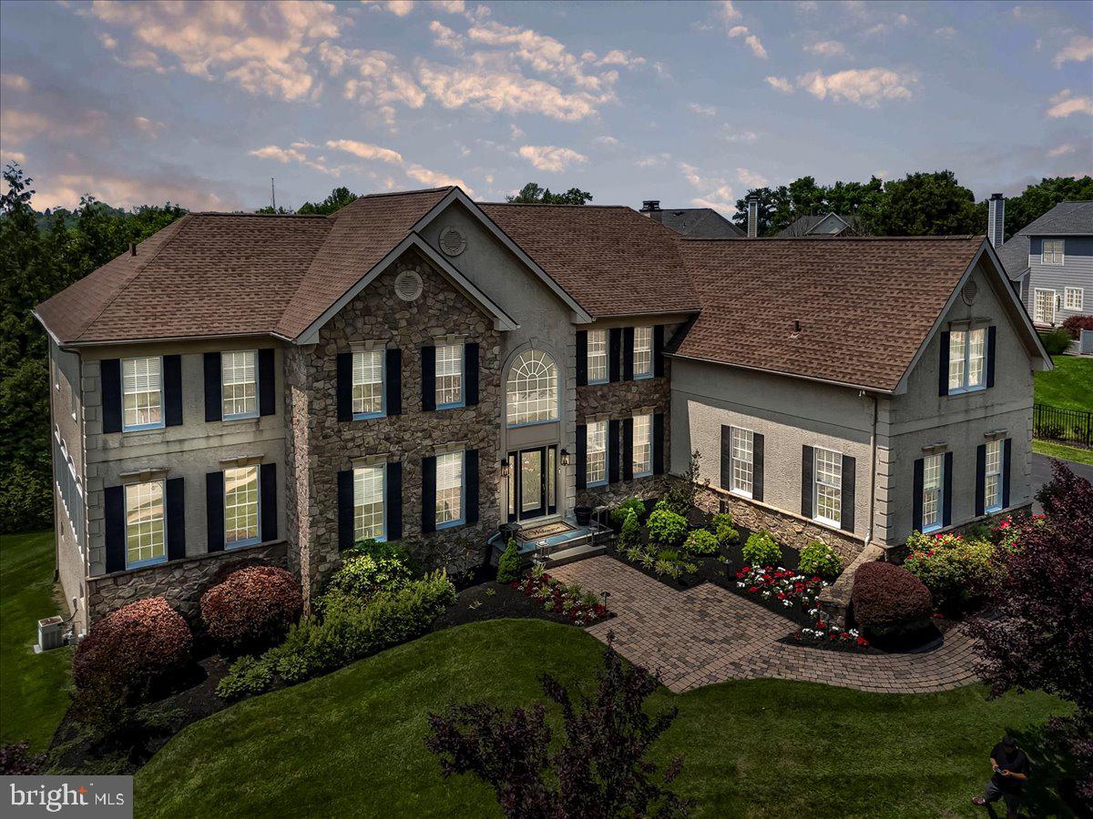 For the discerning buyer, welcome to 22 Thomas Speakman Drive—an extraordinary residence tucked away in the prestigious Garnet Valley Woods community of Glen Mills, PA, within the highly acclaimed Garnet Valley School District. This fully upgraded luxury home offers over 7,000 square feet of impeccably crafted living space, enhanced by elegant custom millwork and recently transformed under the direction of a professional interior designer. Every detail has been thoughtfully curated, from fresh designer-grade paint and all-new premium hardwood flooring and plush carpeting to custom lighting—including LED recessed lighting throughout—and refined, high-end finishes at every turn. At the heart of the home lies a show stopping chef’s kitchen, complete with professionally refinished cabinetry, quartz countertops, a custom herringbone ceramic tile backsplash, and top-of-the-line stainless steel appliances—including a refrigerator, double ovens, a cooktop with downdraft exhaust, dishwasher, and both standard and touch-activated faucets. Under-cabinet lighting and custom shelving in the walk-in pantry add both elegance and function. The main level also features a private home office with custom-built-ins, a formal living room, an elegant dining room, and a sun-drenched step-down conservatory with dramatic floor-to-ceiling windows. Adjacent to the kitchen, a bright solarium leads to a spacious rear deck overlooking a plush, private backyard—perfect for entertaining or relaxing in style. The two-story family room impresses with soaring atrium windows fitted with remote-controlled custom blinds, a floor-to-ceiling stone gas fireplace, den/sitting room, and a sleek custom-designed wet bar. Completing the main level are a designer powder room, large laundry room, and a three-car garage with a premium epoxy-coated floor. Upstairs, the luxurious primary suite is a true retreat, featuring two expansive California walk-in closets and a spa-inspired bath with a jetted soaking tub, a custom steam shower with triple shower heads and frameless glass doors, and a private commode room. Three additional bedrooms each offer their own en-suite baths and private bonus rooms—perfect for guests, hobbies, or home study spaces.
The finished walk-out lower level is an entertainer’s dream, offering over 2000 additional square feet of living space that features a state-of-the-art home theater, separate game room with arcade machines (most included), a full gym with equipment, a billiards area with pool table, wet bar, a fifth bedroom with full bath, and ample storage space. Truly better than new construction, this exceptional home is being offered fully furnished—including all furniture, wall hangings, all lighting fixtures and most personal property are included—along with artwork, TVs, a premium sound system with over 35 ceiling speakers, gym equipment, most arcade machines, and a sprinkler system featuring 40 heads. Turn-key and one-of-a-kind, 22 Thomas Speakman Drive is a rare opportunity to own a designer masterpiece in one of Glen Mills' most sought-after neighborhoods. Do not miss your chance to call this extraordinary property home. Owner is a Licensed PA Real Estate Salesperson.
