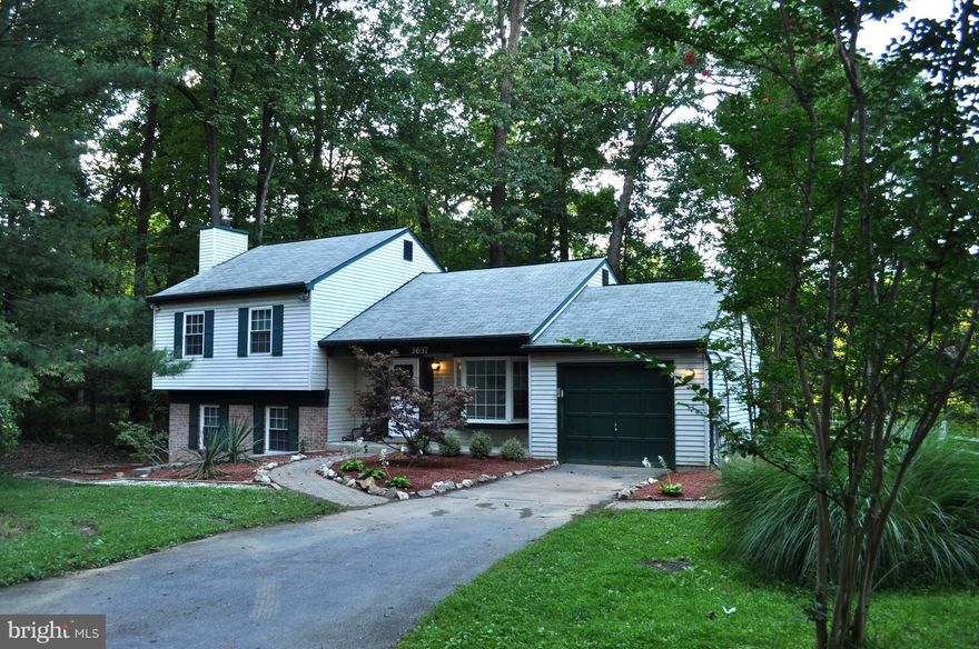 Renovated open-concept 4 bed/3 bath home with great location on cul-de-sac. Beautiful open kitchen with stainless appliances, large island, and granite. Renovated bathrooms with designer tile. Family Room with built-in cabinets and gas fireplace.  Hardwoods on main level. Carpeting on lower level. Expansive multi-level deck in private yard backing to woods. Fully fenced backyard. (Photos taken before current tenants moved in.)