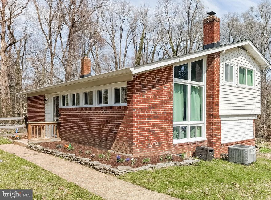 This home has so much to offer.  The lot is larger than you think with a fenced back yard.  The home itself features hardwood floors, a modern kitchen with custom cabinets, granite countertops, upgraded appliances. It  boasts 3 bedrooms upstairs with hardwoods and a renovated bath (2020) with ceramic tile. Master bedroom includes full master bath with oversized shower. Lower level is great for needed storage with spacious laundry area. Exterior features recent power washing  and updated landscaping in the front and ample off street parking.