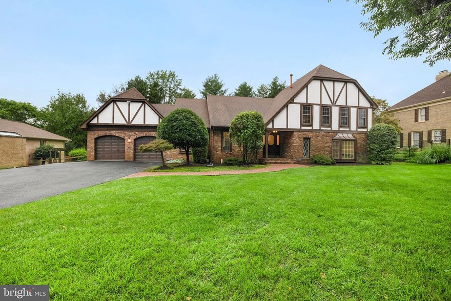 **Offers, if any, due Mon 9/13 by 11am** Rarely-available 5-bed 4-bath Tudor-style home boasting over 3800 sq ft located in Potomac! Enter to a fully-renovated and light-filled main level (2021) with vaulted ceilings, recessed lighting, hardwood flooring and luxurious finishes throughout. The stunningly renovated Chef’s kitchen (2021) is the centerpiece of this home, offering impressive gourmet range hood, custom cabinetry, quartz countertops, large entertainer's island with pendant lighting, custom tile backsplash and top-of-the-line Thermador stainless steel appliances with gas cooking. The open-concept main level is perfect for entertaining guests, featuring a formal dining room, living room and breakfast area; all with large windows and serene tree-lined views. Main level bedroom with adjacent full bath and walk-in closet is ideally-situated for an in-home office, formal sitting room or bedroom for older family members looking to minimize stairs! Cozy up in the family room by the wood-burning fireplace with gorgeous stone surround and wet bar or head outside through the French doors to enjoy a morning coffee or evening drink in your own private oasis. Conveniently-located main level laundry room with full-size front-loading appliances, laundry sink, and updated barn door doubles as a mudroom off garage.  Relax in the massive owner's suite with a separate sitting area, two walk-in closets and ensuite bath. Spa-like owner's bath with skylight offers dual-sink vanity, tiled stand-up shower and jetted soaking tub with calming views of the wooded area.  Three additional generously-sized bedrooms and full bath complete the upper level. Lower level offers a large rec room for movie nights plus bonus rooms for gym and extra storage. Potential 6th bedroom with full bath on the lower level is perfect for an in-law suite or au-pair. Host the perfect BBQ in your fully-fenced rear yard with two-tier slate patio, amazing wooded views and nearly 1/2 acre of space! Expanded driveway and 2-car garage provide parking for 5+ cars. Other recent upgrades include HVAC (2008), windows (2009), and water heater (2013). Easy access to Seven Locks, 495, River Rd, and 270. Just minutes to Balduccis, Montgomery Mall, and all that downtown Bethesda and DC have to offer! Seven Locks ES, Cabin John MS and Winston Churchill HS district. Don't miss this!