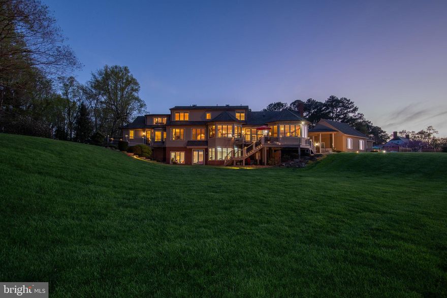 This  fabulous property is the epitome of Rappahannock River Lux with the ability to accomodate an intimate gathering of friends, family or larger cocktail parties and soirees with ease. Sited upon a high promontory with a commanding presence, this property overlooks one of the most scenic and serene views of the Rappahannock River, north of Tappahannock, Virginia.   Exterior amenities include a 20'x 40' inground gunite pool, well appointed pool house with kitchen bar, full bath,  large screened in patio,  two detached garages, lawn equipment garage, outdoor patios, extensive brick, stamped concrete and stone hardscaping, decking, low maintenance  plantings, an expansive lawn and pillared entrance. The interior of this property is beautifully appointed with walls of windows to frame in a view that captivates every hour of the day.  Interior amenities include a beautifully appointed staircase which ascends and descends between three living levels -  to the other living areas of the home.  Large chef's kitchen with wine bar, wine chiller, refrigerator/freezer, wall oven, microwave, double sinks, island, gas range with downdraft vent, granite counter tops, pantry and  wrap around kitchen bar.  Spacious breakfast nook overlooks the waterfront, as does the formal dining room with built ins.  The living room is a handsomely appointed room with fireplace and  water views that put the river front and center.  The first floor has two full baths and powder room near the kitchen as well as dedicated  laundry / mud room.  On the opposite end of the first floor lies a lovely corridor which leads to the first floor primary - ensuite.  This suite has its own dedicated full bath, balcony and deck which cannot be accessed from any other part of the house.  It is truly an intimate and restorative oasis. Upstairs three bedrooms, three full baths, loads of storage, an office and bonus room, (all with views of the waterfront) await! If all this was not enough, the walk out basement level features numerous areas for enjoying a round of billiards, cards, ping pong or anything else that comes to mind.  Exterior brick and extensive stone patios, outside staircases, decking and so much more, make this a property without equal, in the region. Pier, Dock, two boat slips, one jet-ski lift and additional mooring are ready for the summer boating and fishing season.  Located between Tappahannock and Caret, this property is convenient to Fredericksburg, Washington D.C., Richmond, Williamsburg and the Northern Neck.  The Tappahannock Regional Airport is within 18 minutes.  Convenient to International Airports in Richmond and Washington, DC.  A warm, welcoming community awaits with great restaurants, museums, historic sites, art galleries, boutiques, charming small towns, farmers markets, , caterers, shopping, medical facilities, hospitals, marinas, wineries, breweries and more  are all convenient.
