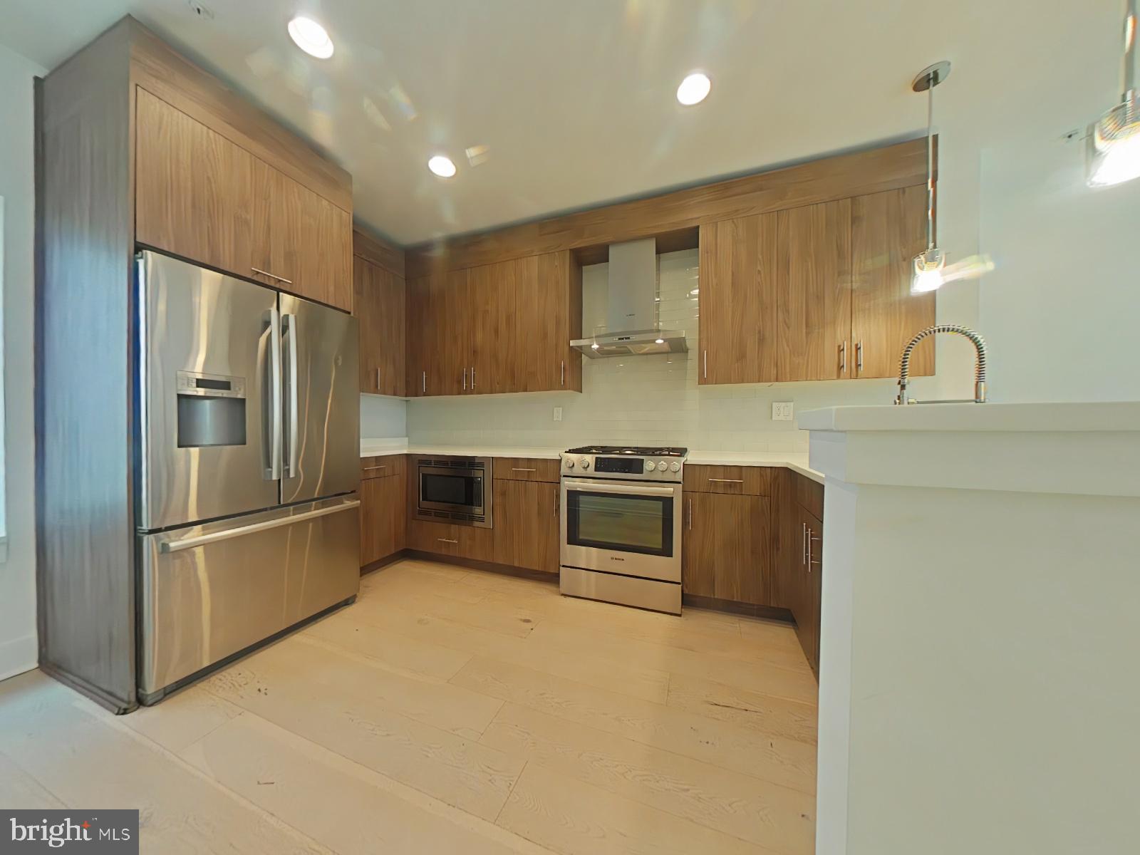 Luxurious Townhome in the Heart of Northern Liberties!
Nestled in a private, tucked-away community, this stunning 3-bedroom 3-bathroom townhome offers the perfect blend of modern elegance and urban convenience. Located in the vibrant neighborhood of Northern Liberties, you're just steps away from some of the best dining, shopping, and entertainment options the city has to offer while enjoying the privacy of a quiet retreat.
Step inside and you are welcomed by beautiful hardwood floors throughout, a designer kitchen featuring quartz countertops, custom wood cabinetry, high-end stainless steel appliances, and stylish fixtures. Each of the three spa-inspired bathrooms are adorned with glamorous tile work and luxury finishes.
On the second floor is where the living room, dining area and chef's kitchen is located. The expansive living room is the perfect place to entertain friends and family for special occasions for everyone to enjoy. Right next to the living room is the dining area to enjoy delicious meals made right from the kitchen. Adjacent to the dining room is every chef's dream of a kitchen which features tons of countertop and cabinet space, top of the line stainless steel appliances, and a breakfast bar for quick meals in the morning.
The expansive primary suite is a true sanctuary, complete with walk-in closets, a spacious bedroom area, and a beautifully designed en-suite bath boasting a glass-enclosed shower, double wall-hung vanity, and exquisite tile detailing. The two additional bedrooms are generously sized with ample closet space.
13-month HWA home warranty will be included with acceptable offer.
Take in breathtaking Center City views from your private rooftop deck, the ultimate space for relaxing or entertaining. Enjoy the convenience of a built-in dry bar with a fridge, counters, cabinets, and a stylish tile backsplash—perfect for hosting guests or unwinding after a long day.
This home offers the best of luxury living in one of Philadelphia’s most sought-after neighborhoods.
With an impressive walk score of 87, daily errands are easily accomplished without a car.
Boasting a transit score of 78, public transportation is readily accessible, making commuting convenient.
The bike score of 83 highlights the excellent biking infrastructure, ensuring a smooth and enjoyable ride throughout the area.
This prime Northern Liberties location offers easy access to top dining spots like Jerry's Bar, Germantown Garden, and The 700. Conveniently situated near General Philip Kearny School and Benjamin Franklin High School, this home is also just minutes from daily essentials, including Penn Herb Co. for grocery needs.
For outdoor enjoyment, residents can explore Liberty Lands Park, Tiptop Playground, and the Edgar Allan Poe National Historic Site, all just a short distance away.
Schedule your showing today!