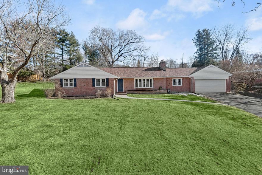 Enter into this sun-filled open floor plan where living and dining areas boast beautiful hardwood flooring, a bay window, and a cozy wood-burning fireplace, creating a welcoming ambiance. The renovated kitchen is a chef's dream, showcasing black quartz countertops, 42-inch cabinetry, and stainless appliances. A family room with accent brick walls adds charm and character to the space and offers patio access. Three entry-level bedrooms and two full baths offer comfort and convenience, while the primary bedroom features 2 closets and an attached full bath with a dual vanity and an oversized glass-enclosed shower adorned with decorative tile inlay. The finished lower level expands the living space with a recreation room featuring recessed lighting, a fourth bedroom, along with abundant storage space. Outside, the beautifully landscaped yard beckons with a patio, play area, and a fenced vegetable garden, perfect for outdoor enjoyment and entertainment. New roof was installed in 2020 with a 50 yr. warranty.  This home offers comfort, style, and functionality in a desirable neighborhood.