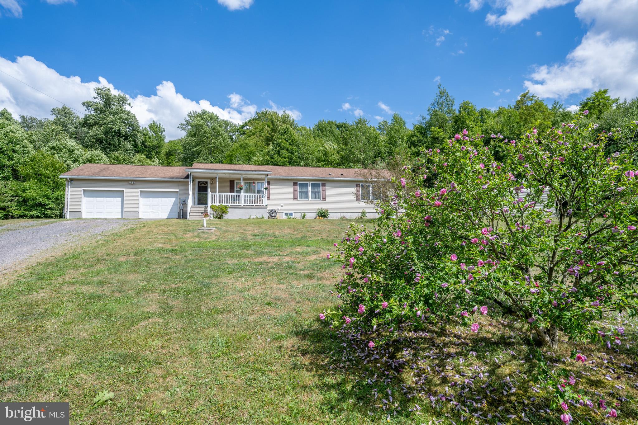 Perfect for a full time residence or a private getaway, this 3 bedroom/2 bathroom home is located within a short drive of Deep Creek Lake and the Yough Lake. 18 acres, mostly wooded, provide a secluded and private setting among some of the most beautiful parts of Garrett County! Featuring single level living, the laundry room is on the main level, as well. The full basement is a clean slate for possible additional living spaces. The 2-car attached garage and an outbuilding/shed offer plenty of storage for automobiles, tools, and equipment. A porch and an expansive deck, along with a fenced area, offer space to enjoy the outdoors.