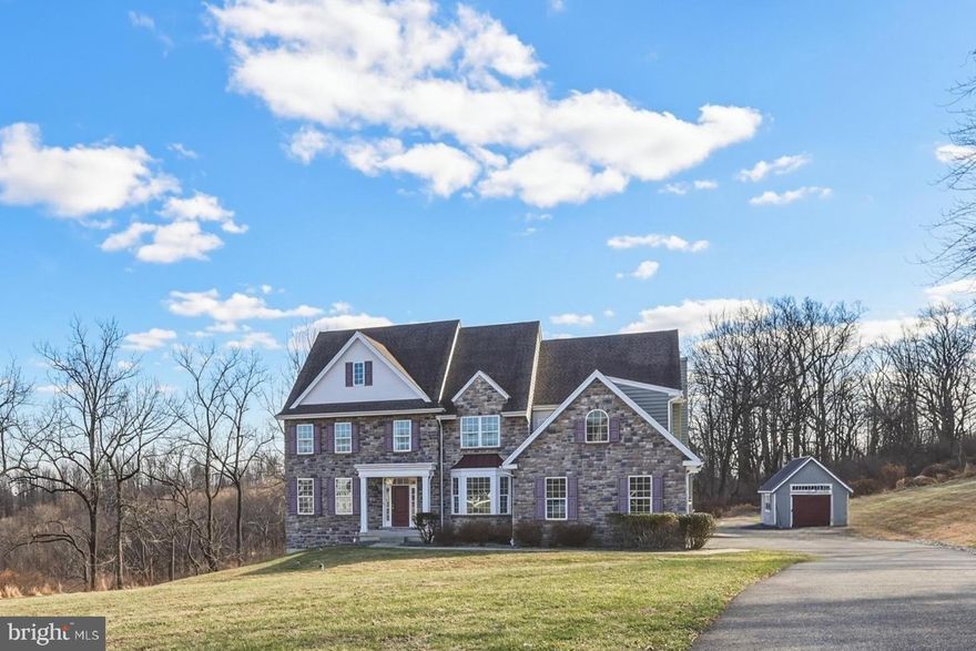 Nestled in the peaceful countryside of Zionsville and within the EAST PENN school District you will find elevated spacious living in this 5 Bedroom , 5 bath home with over 4500sf. Enter the impressive 38' center hall with hardwood floors, wrought iron staircase, and spacious rooms throughout. Gourmet kitchen with granite countertops, gas range, double wall ovens, butlers pantry and dining area open to the large deck and patio and to the vaulted Family room with fireplace. Large private 1st floor office, dual powder rooms, dual staircases. 3 car garage plus two Amish built shed garages on this 3.5+ acre lot. The walk-out basement is available for future expansion with rough-in for a future bath. Expansive and private lot with long distant panoramic views offers a relaxing retreat while being within easy reach of nearby towns, shopping, and commuter routes.