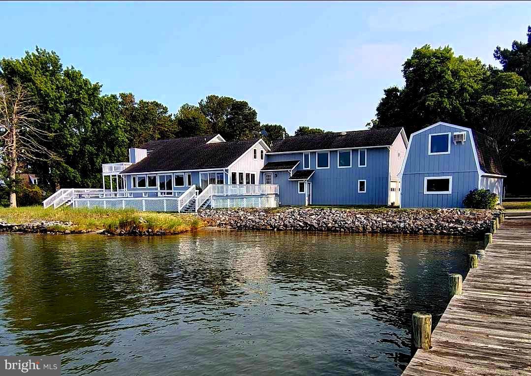 Welcome to one of the most extraordinary waterfront homes in Virginia’s Northern Neck—a true sanctuary set on 2.26 private acres with 540 feet of pristine shoreline along Dividing Creek. Offering spectacular panoramic views, deep water access, and unmatched privacy, this property is a dream retreat for those who love nature, luxury, and the water.
Inside, the main level boasts a light-filled open floor plan with soaring high ceilings and oversized windows that showcase stunning water views from nearly every angle. The kitchen offers expansive storage, including a massive walk-in pantry, granite countertops, and seamless flow into the main living and dining areas—perfect for both quiet evenings and lively gatherings.
Two master bedroom suites—one on the main level and another upstairs—both provide rare flexibility and luxurious accommodations for both owners and guests. The main-level suite features private water views and direct access to the outdoor living spaces, creating a true single-level living option.
Upstairs, you'll find three additional spacious bedrooms and a large bonus room ideal for guests, creative pursuits, or working remotely. One bedroom even offers rare sightlines to three different bodies of water—a breathtaking and unforgettable feature. Throughout the home, natural light pours in through well-placed windows, while recessed lighting adds a soft, modern touch.
The lower level and outbuildings greatly expand your possibilities. A large, air-conditioned studio and extensive workshop offer space for woodworking, art, or even a future home business. These structures also hold strong potential for conversion into a charming guest cottage or income-producing rental. A detached storage building with a loft further enhances your options.
Outdoors, a 1,008 sq. ft. waterside deck and an upper balcony provide the perfect spots to enjoy the breeze, watch boats drift by, and take in the serene beauty of the creek. The deck was recently refinished and the exterior of the home and shed was freshly painted by a top contractor. New gutters were added. The deep, clean water (6–12 feet) is perfect for boating, kayaking, fishing, and swimming to the nearby sandy beach. The dock was recently rebuilt and includes one boat lift and two jet ski lifts.
Nature lovers will delight in frequent sightings of dolphins, pelicans, herons, egrets, swans, ospreys, and bald eagles. With ample room for a pool, hot tub, or custom backyard retreat, the potential here is only limited by your imagination.
Additional highlights include a two-car garage, triple-zoned HVAC, a 50-year roof with 33 years of life remaining, and stunning rose gardens. $22,000 worth of rip-rap was added. Recent upgrades include new granite countertops, tiled bathrooms with cement board, recessed lighting, shed siding and doors, exterior lighting, garage door openers, and charming new trellis and latticework was recently installed. The average winter electric bills are around just $167, comfort here comes with efficiency.
Just minutes from the charming town of Kilmarnock, you’ll enjoy boutique shopping, fine dining, art galleries, and the family-friendly Compass Entertainment Complex. You're also close to the renowned Tides Inn Resort and within easy reach of Richmond (90 minutes) and Washington, D.C. (under three hours).
Whether you’re looking for a private waterfront retreat, an investment opportunity, or a one-of-a-kind primary residence, this home delivers exceptional beauty, comfort, and potential—truly one of the best locations on the East Coast. You will love that the home is only 50' from the water, most homes are 100'!
During hurricane Isabel water never got into the house. The crawl space is 4 feet high.
(Notes: at this property, you are allowed to have a guest house and if you would like to add a pool you can.)