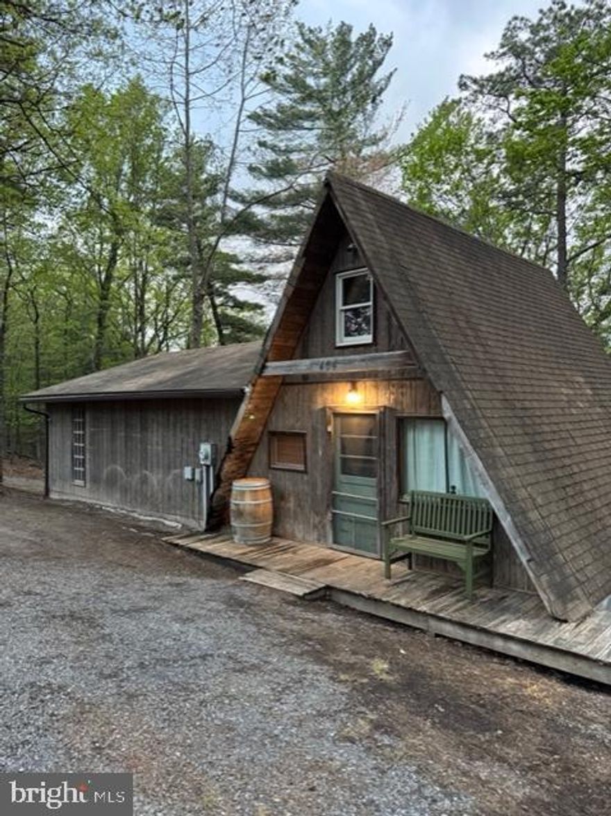 Attention Investors.  This home needs a lot of love but is a diamond in the rough.  A-frame part of cabin is livable with some upgrades but the rest of cabin needs to be finished.  Large framed addition with block basement that has not be finished.  Shared Well that needs line repair and owner has used installed water tank for water.  Cabin has a loft with spiral metal stairs to loft and basement.  Cabin has strong bones but needs finishing and upgrades to make it truly livable.   2 bedroom septic with shared well that needs line repaired.  Views of the Western mountains give this cabin the perfect location for a retreat or full time living. Lots of sweat equity to be established with this property.  Cash or conventional are your only options but the investment gain is here.  Want a project that can have great rewards, this is it.  Bring your imagination and your tools..  This could be something Special....