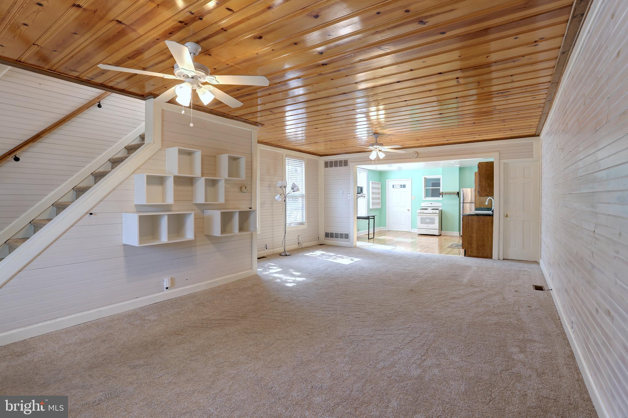 Huge Price Reduction! Come see this adorable home, you will not be disappointed. Much larger than it appears! Adorable 3 Br, 1.5 baths. Open floor plan on main level, new carpet in 2022. New Roof and gutters in 2020. Knotty pine ceilings add a cozy and comfortable feel. Kitchen has brand new ceiling with recessed lights and a gas stove. Detached bonus room/3 seasons room/playroom with electric. Detached shed and side yard with new privacy fence in 2018. Attic was just cleaned, sealed and re-insulated in 2023. Sellers installed extra shelving in the kitchen, living room and laundry room that will convey.