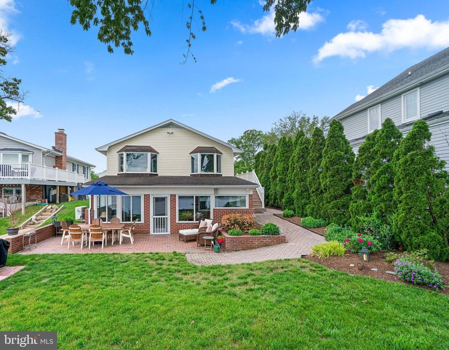 Welcome home to Severna Park waterfront living with deep water, private pier and phenomenal huge views of the Magothy River. With numerous updates and meticulous care this home is ready for the next owner. Nearly 3/4 of an acre with 50+ feet of water frontage and MLW of 8'  plus 3 boat lifts- bring your boat and jet skis for easy access right to the Magothy. The spacious layout features 3 bedrooms with 3 full bathrooms with over 2,600 sq feet of finished living space including updated bathrooms, a spacious open concept newly redesigned kitchen, a rear sunroom and  lower level kitchenette perfect for waterside entertaining!  Entertain family or friends in the spacious lower level complete with newly finished living room with built in shelving, a custom built in work & entertaining space all open to the 4 season room with zoned heating/ac to enjoy year round.  Step out back to the brick patio overlooking the huge river views along with the private stairs that take you to the private dock with additional relaxing space.  Retreat to the spacious primary bedroom suite with a spa inspired bathroom featuring dual sink vanity, floor to ceiling tile and a glass enclosed shower.  Another generously sized bedroom and full bathroom on the upper level plus a large lower level bedroom with a full bathroom offer ample space. All bathrooms have been completely updated. Designer neutral paint and updated lighting & flooring throughout, you will love the attention to detail and the craftsman inspired finishes everywhere.  Set back far from the street with a meandering driveway, there is ample parking plus storage with a spacious front shed with an additional waterside shed.  Settle in time to enjoy a full boating, fishing and crabbing season.  Severna Park Blue Ribbon Schools. Easy commuter access.  Schedule your private tour today!