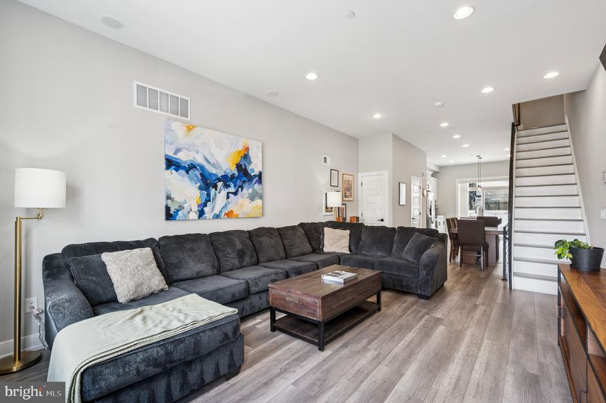 A contemporary home with all the bells and whistles in the heart of Norris Square! Originally developed by one of Philly's most prestigious builders, V2 Properties, this home is impeccably designed and fit for a buyer looking for proximity, community, and overall convenience. Welcome to 2210 N Hancock, a 3 BD/3.5 BA home and arguably one of the BEST value finds you'll find in the neighborhood! From hardwood flooring and a finished basement to an oversized galley kitchen and swoon-worthy rooftop deck, this home was crafted with every Philly homeowner's wishlist in mind. Step through the front door into the open main floor; the living room flows into the dining area and is completed by a bright, open kitchen with countertops/cabinets galore! The kitchen is one of the many focal points; the white shaker cabinets, quartz counters, waterfall island, plentiful storage, and stainless steel appliances make it a timeless place for any homeowner. Immediately off the kitchen is a convenient half bathroom and cozy patio to savor the summer nights. The second floor is home to two sizable bedrooms and a hall bathroom. The third floor is home to a wet bar, primary suite, a walk-in closet, and an en-suite bathroom. One more quick flight up and through the pilot house, and you have one of Philly's best vantage points (hello, rooftop deck). Lastly, the finished basement offers additional bedroom/living space thanks to the egress and third full bathroom. Whether you use it as an additional guest room, living room, workout area, or combo of the three, you'll be content knowing this home offers endless uses and spaces and grow into it comfortably over the years! Steps from Norris Square Park, Rowhome Coffee, Harbison Dairy, Lost TIme Brewing, Fiore, Little Walters, LMNO, and all of Fishtown's best shopping and dining. Roughly 5 years remaining on the tax abatement!