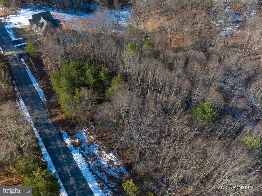 Discover the perfect blend of privacy and convenience with this stunning wooded parcel in sought after Round Top Estates community.  Tucked away in a premier cul-de-sac street location this property offers a peaceful retreat while being just minutes from I-81, making commuting and access to amenities a breeze!
Recently surveyed and Perc approved this lot is primed for your dream home.  
If you are looking for a serene, wooded escape this is your opportunity to own a little piece of WV heaven!
