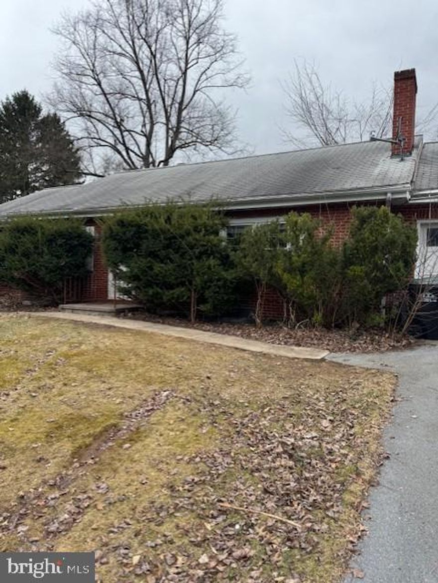 Being sold "as is". Lots of potential with this spacious ranch. Walk or bike to campus and downtown. All brick construction with attached 1 car garage. Hardwood floors, gas furnace, unfinished lower level is walk out. Large back yard. Great opportunity for a Borough home to make your own.