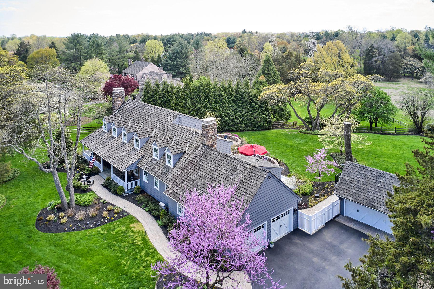 Nestled within the coveted Cedar Glen neighborhood, this fully renovated residence spans over 7,000 square feet across three meticulously crafted levels. Every inch of this home reflects unparalleled craftsmanship and an unwavering commitment to quality, offering a living experience that seamlessly blends timeless elegance with luxury comfort. At the heart of this home lies a chef’s dream kitchen, featuring a sprawling quartzite island with bar seating, a six-burner Wolf range with griddle, and 48” Pro Sub-Zero refrigerator. Adjacent to the kitchen, the butler’s pantry is equipped with multiple Sub-Zero appliances, including a second refrigerator, wine fridge and refrigerated drawers, ensuring effortless entertaining. The spacious dining room, adorned with a cozy fireplace sets the stage for memorable gatherings. The family room, with its rustic stone hearth, invites relaxation and warmth. Completing the first floor is a private office with powder room, a mud room with a stunning full bath, washer/dryer, and an additional Sub-Zero refrigerator. This home was designed with intention to ensure the perfect balance of luxury and function. Upstairs, the primary suite offers a spa-inspired marble bath with radiant heated floors, creating a serene retreat. Three additional bedrooms share a beautifully appointed marble bathroom, also with heated floors, and an upstairs laundry room adds everyday ease. Tucked away via a private staircase, a secluded home office overlooks the lush backyard—an ideal work-from-home sanctuary. Cleverly integrated into this space is a hidden Murphy bed, offering the option of an additional guest retreat. The fully finished lower level offers unmatched versatility, featuring a large entertainment area, home gym, and a flexible bonus room—perfect for a future bedroom or in-law suite—with a luxurious full bath and expansive storage. Outside, enjoy resort-style living all year long. The private, fenced yard includes a built-in fire pit, sprawling patio, hot tub, and an extraordinary Endless Swim Spa equipped with a treadmill, resistance machine, and hydro-massage jets—all protected by a retractable Covana cover for four-season enjoyment. Mature landscaping, custom lighting, and a full irrigation system add both beauty and ease. Additional amenities include a two-car attached garage, a detached two-car garage with upper-level storage, and secure pet-friendly fencing. Nestled in the highly sought-after, rarely available neighborhood of Cedar Glen—just minutes from I-95 and under two miles to the vibrant shops and dining of New Hope—this exceptional property offers the perfect blend of tranquility, convenience, and elevated living. More than a home—this is a lifestyle. And it’s completely move-in ready.