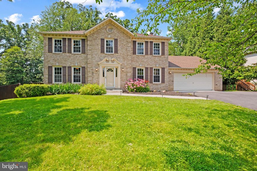 STONEGATE. If you know, you know: winding streets, towering trees, lush lawns, and timeless homes. Summers at the swim club. Lifelong friendships. It’s not just a neighborhood, it’s a legacy.

Now, this stately center-hall Colonial is ready for its next chapter—with you in it.

Start your day in a luxurious primary suite with cedar closet, dressing area, and jetted soaking tub. The updated hall bath with double sinks means no one's fighting for mirror time. Downstairs, whip up breakfast in a gourmet kitchen with ample storage, then soak in the morning light from the glass-enclosed sunroom. Need to work? Your private study with built-ins is made for focus. When the day winds down, gather in the cozy family room, complete with wood beams and a wood-burning fireplace perfect for movie night.

Out back, entertain on a sprawling composite deck overlooking a fenced yard ideal for a swing set, a dog run, or both. Rainy day? Head to the finished basement with a rec room and built-in bar, just in time for kickoff.

Practical perks? Absolutely. A two-car garage with redone floor. A recently-replaced roof. An oversized mudroom with room for all the shoes, coats, and backpacks. A whole-house generator that keeps the lights—and the good times—on.

You’re steps from a brand-new elementary school, two parks, and the private Stonegate Swim Club. With New Hampshire Ave and Route 200 just minutes away, downtown Silver Spring and the I-270 corridor are always within easy reach.

Stonegate living: It’s more than a home—it’s a feeling.