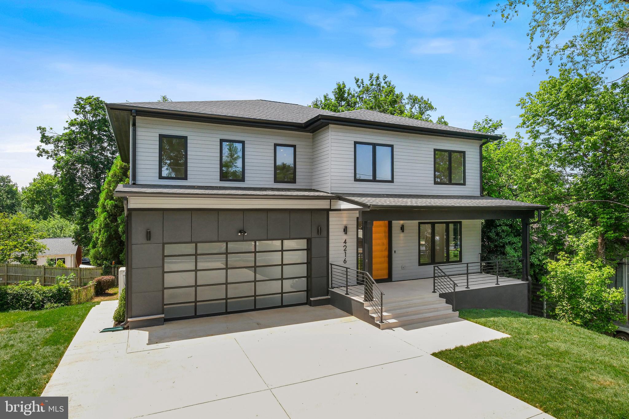 BUILDER INCENTIVE! For 3-1 Buydown Loan Option!!! Example: 3% lower than the full rate in year 1, 2% lower in year 2, 1% lower in year 3. (Buyer can refinance anytime)
Exceptional Space and Refined Craftsmanship in the Heart of Coveted Kensington Terrace
An exquisitely re-imagined residence in the coveted Kensington Terrace neighborhood, this expansive home artfully combines refined craftsmanship, sophisticated design, and modern functionality.
Boasting seven generously proportioned bedrooms and four full and one-half baths, this residence is thoughtfully tailored for today’s discerning lifestyle, offering exceptional space for family, guests, and entertaining.
From the moment you step inside, the craftsmanship and attention to detail are unmistakable. The main level features rich engineered hardwood flooring, while soaring 9-foot ceilings on the first and second floors—and over 8-foot ceilings in the finished basement—create a bright, open atmosphere throughout.
At the heart of the home is a chef’s kitchen designed for both daily living and entertaining. It features premium KitchenAid appliances, including a 48-inch refrigerator, built-in oven and microwave, and a gas range. A striking waterfall island with seating, a walk-in pantry, and a sleek mini bar with a built-in beverage fridge provide both elegance and practicality. The living room opens effortlessly to a private deck, inviting seamless indoor-outdoor living, perfect for serene mornings or sophisticated evening gatherings overlooking the expansive backyard.
Each of the seven bedrooms is thoughtfully designed with direct access to full or dedicated bathrooms, ensuring privacy and comfort for all. Two bedrooms on the finished lower level offer versatile spaces ideal for guests, multigenerational living, or home office and fitness areas. A main-level full bath with a handicap-accessible shower further enhances the home’s versatility for multigenerational living or long-term guests.
Additional highlights include a cozy gas fireplace, 4-inch recessed LED lighting throughout, a convenient second-floor laundry room, and a custom mudroom with built-in cubbies and ample closet space for streamlined organization.
Outside, the large, private backyard provides ample space for entertaining, gardening, or outdoor play. The home is finished with low-maintenance composite shiplap siding and a durable 50-year architectural asphalt roof. The extra-wide driveway leads to a spacious two-car garage, providing both practicality and curb appeal.
Located in a well-established and desirable neighborhood, this home offers unbeatable access to everyday conveniences. It’s just a short drive to Wildwood Shopping Center and Georgetown Square—home to Balducci’s, DSW, CVS, Le Pain Quotidien, Capital One, and more. The Rock Creek Trail is within walking distance, with two scenic miles of the 14-mile trail wrapping around the west side of Parkwood, making it ideal for biking, jogging, or taking peaceful walks by the water.
With easy access to I-270 and I-495 and within walking distance of NIH, Walter Reed National Military Medical Center, and the Metro, this location also places you minutes from Downtown Bethesda, Westfield Mall, Pike & Rose, and a wide variety of dining, shopping, and entertainment options.
Blending timeless design, generous space, and everyday convenience, 4216 Knowles Avenue is a rare opportunity to own a turnkey home in one of Kensington’s most desirable communities.