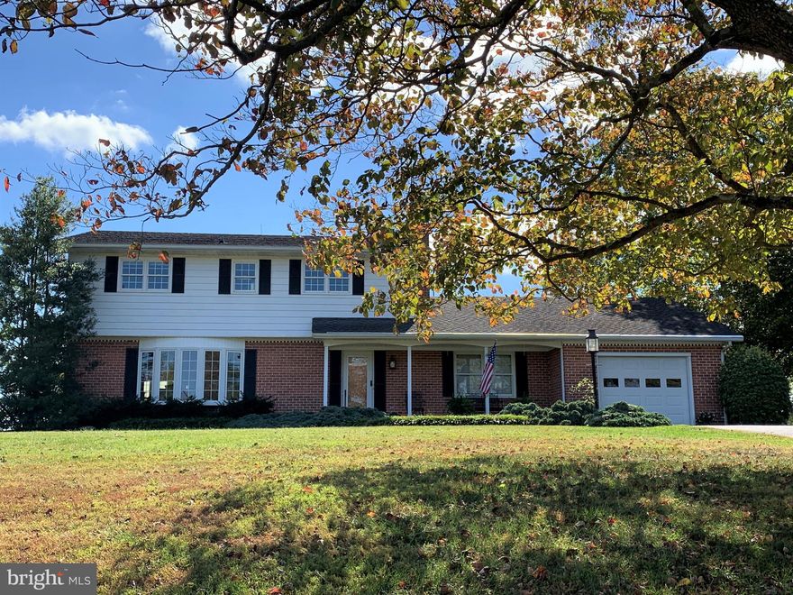 Welcome to this lovingly cared for and updated home by original owner, perched on a level 1 acre lot overlooking rolling hills and farmland! You will fall in love with the glorious panoramic views, gleaming hardwood floors and lots of natural light throughout, first floor family room with cozy fireplace and doors to the brick patio, updated, open concept gourmet Kitchen with stainless steel, Wolf cooktop, built-in double oven, pantry, breakfast room and formal dining areas, ideal for hosting holiday gatherings and more! The 4 generous bedrooms include Master suite with full bath, and ample comfort for family and quests. Unfinished basement with outside entrance is a blank slate awaiting your ideas! Tiled baths and first floor laundry, new CAC in 2012, built-in storage and workbench in attached garage, large storage shed, and parking pad round out this well-appointed residence. Ideally located off the beaten path, yet minutes to schools, Eden Mill Park/Nature Center and commuter routes. Farms on each side in Ag Preservation.  Must see!