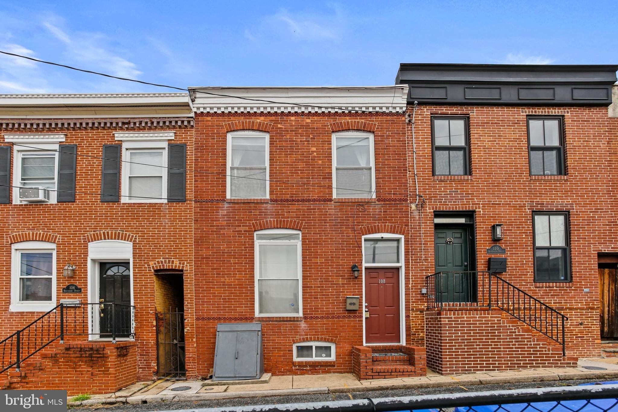 Charming 2‑bed, 1‑bath brick‑front rowhome nestled in the heart of Federal Hill’s Riverside neighborhood. Originally built in 1900, this cozy 920 sf home blends historic character—exposed brick, original hardwood floors, and classic Federal‑style details—with modern comfort. The bright galley kitchen provides generous countertop space and modern appliances, while the oversized full bath on the upper level offers convenience rarely found in similarly sized homes. In‑unit washer/dryer located in the bath adds everyday ease. Enjoy central heating and cooling throughout with a 2023 HVAC system and 2021 Water Heater. Situated on a quiet block just steps from Fort & Light yet offering ample permit parking, this home delivers the best of neighborhood tranquility and city living!!
