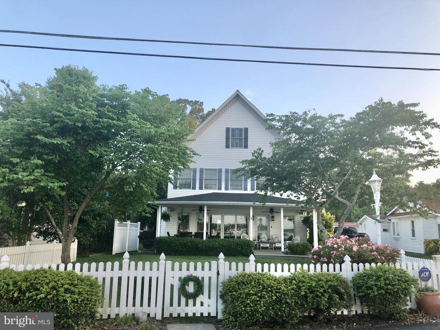 Coastal living at it's best! Deepwater pier with 3 lifts. Easy commute to DC Northern VA, Annapolis, Baltimore. Located in the sought after West River Community of Back Bay Beach. Restaurants and fuel dock are minutes away by water!
Enjoy the stunning views of the West River as you arrive home on the community's private road.  
The spacious and open main level, with floor-to-ceiling Pella windows and doors, provides beautiful panoramic views of the river from the kitchen, dining, living room and front porch areas of the main level, reminding you waterfront fun  is at the ready.. The wonderful views are flanked by a 6' linear fireplace with great stone surround. The kitchen is an entertainers delight, with  expansive granite counter space and new appliances. The main level bedroom suite with a custom designed bath is perfect for one level living, if desired.
 9 ft ceilings , Brazilian cherry wood flooring, and crown molding further enhance the main level. 
 Great outdoor space with  huge water views, large covered porch and lawn sloping toward the river and pier. Nice beach area, tide permitting.  Spacious 2 car garage with large work area. 
A great seating/lounge/office area with built in shelving and panoramic water views greets you as you reach the second level. White oak flooring covers the stairs and extends throughout this level, including the second primary suite with en suite bath, walk in closet, and large balcony. The level includes the homes 3rd and 4th bedrooms, and 3rd full bath.
New Carrier high efficiency AC and furnace were recently installed 2023. Solar panels support clean, green energy efficient home. Simply move in and relax. 
No mandatory HOA. Flood insurance not required as per FEMA map. 
West River offers restaurants accessible by boat, a sailing club, yacht club, multiple marinas, and room for all watersports. Don't buy crabs, go catch them yourself!
A community boat ramp is available to Back Bay Beach residents.
Easy 45 minute commute to DC, Northern VA. Baltimore, downtown Annapolis and the Naval Academy approximately 30 minutes.