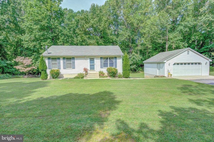 3bd 2 ba Rambler on 2 acres in Huntingtown! Wood flooring throughout the living room, kitchen, and first bedroom. Gleaming white eat-in kitchen leads to a multitiered back deck w/ hot tub overlooking your large & flat backyard. Bsmt feat. an additional bedroom, bathroom, family room, and bar! 2 car det. garage is great for protecting your cars or additional storage! Home Warranty included!