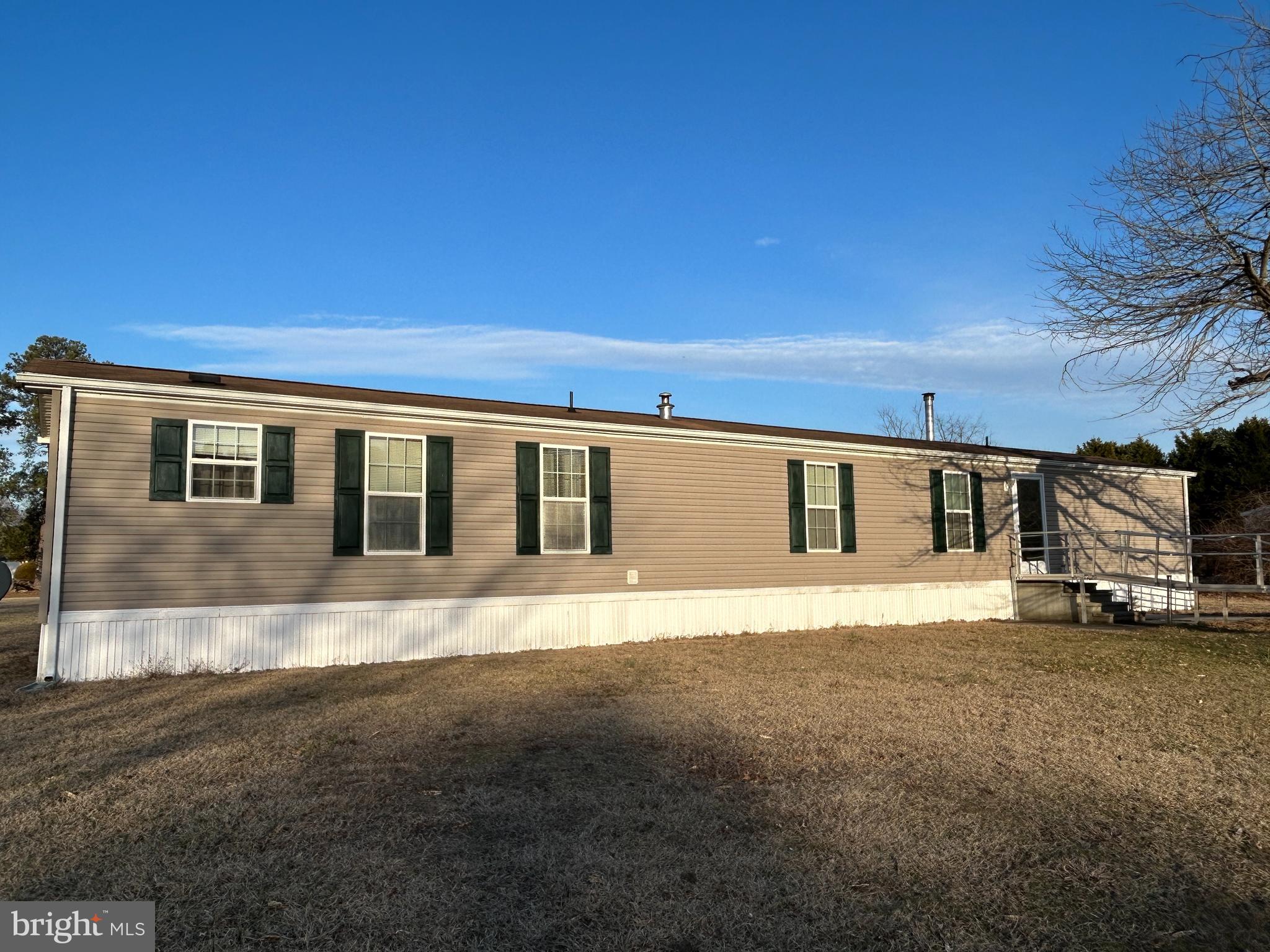 Welcome inside this 2 bedroom, 2 bath mobile home located in Cedarhurst MHP, in Salisbury, MD! When you walk in the front door you will enter into the living room which offers natural light and a gas fireplace. The living room flows into the dining area. The dining room has a built in china cabinet and over looks the living room and kitchen. The kitchen offers abundant cabinet space and a built in pantry for additional storage. Next to the kitchen, you will find the conveniently placed laundry room near the back exterior door. Out the back door is a deck that overlooks the large back yard. On one side of the home, you will find the master bedroom with a double closet and an attached master bathroom. The master bathroom offers a double vanity, soaking tub and walk in shower. On the other side of the home, you will find the spare bedroom which is located near the second full bathroom. The home has multiple storage closets and there is a large shed in the backyard. Buyers must be approved by the park before moving in. Ground Rent is $530 per month which includes water, sewer, and property tax. Trash is $11.66 per month. Call today to schedule a private tour!