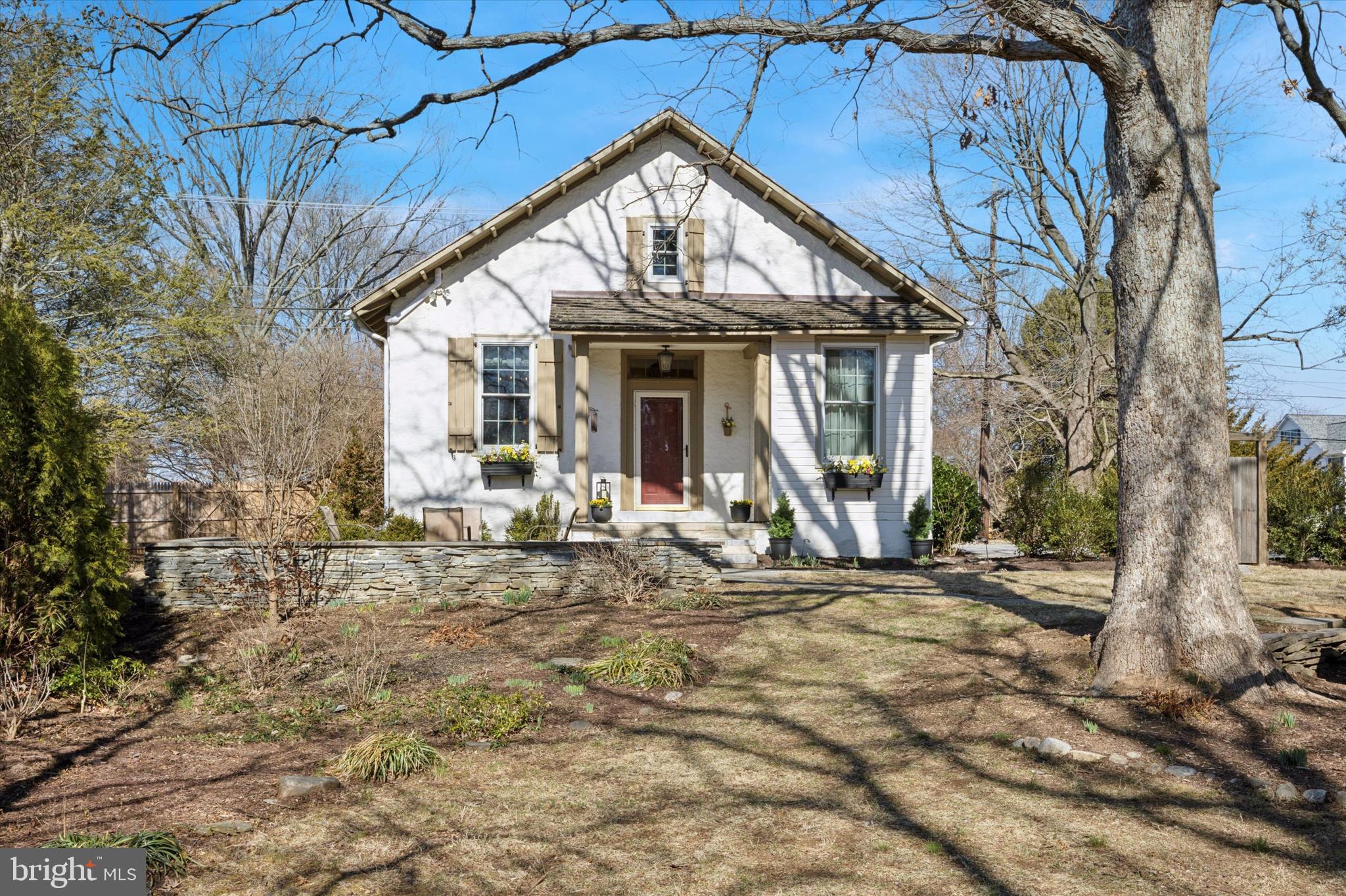 Welcome to 700 King Rd, a beautifully updated historic schoolhouse featuring 4 bedrooms and 2.5 full baths, nestled on 0.875 acres of picturesque landscape with private gate and expanded driveway. This unique home seamlessly blends timeless charm with modern upgrades, offering a perfect balance of history and comfort. Step inside to find, soaring 10.5 ft ceilings, exposed stone walls, deep window sills, and gleaming freshly refinished random-width wood floors create an inviting atmosphere, enhanced by custom Andersen windows that fill the home with natural light. The beautifully updated kitchen features custom cabinetry, extended countertops, under-cabinet lighting, and stainless steel appliances, perfect for cooking and entertaining. The thoughtfully designed layout includes a first-floor primary suite, with fresh paint throughout, and a full en-suite bath with skylight, another bed and bath are on this level while two additional bedrooms upstairs and a second full bath provides space for family or guests. A newly finished multi-purpose lower level offers flexibility as a playroom, home gym, or media space. Outdoors, the home shines with two expansive flagstone patios, a fire pit/grill area, a new fence (2023), and professional landscaping with perennial gardens and mature trees, including a stunning magnolia. Hard-wired outdoor lighting and pathway illumination add ambiance, while the extended driveway, shutters, and window boxes enhance curb appeal. Recent upgrades include two brand-new AC units (2024), a cedar shake roof (2014), and a radon mitigation system, stucco repaired, and new Bilco door. Centrally located just minutes from Route 202, Malvern borough, main street Exton, and downtown West Chester, with easy access to corporate centers, train stations, and East Goshen Park, Boot Rd Park, Exton Park w/ dog park, Malvern Memorial park, This one-of-a-kind historic home is a rare gem, combining timeless charm with a highly desirable West Chester location.