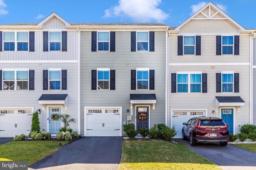 WHY WAIT?! Practically brand new with ALL the upgrades AND top care from one owner! Welcome to 303 Bait Rd in Inwood, WV — an immaculate 3-level townhome that offers the feel of new construction without the delay. Lovingly maintained and beautifully upgraded by its current owners, this home is truly move-in ready.

Enjoy 3 spacious bedrooms, 2.5 bathrooms, and an open-concept layout filled with thoughtful design. The kitchen is a SHOW-STOPPER, featuring granite countertops, a stunning Italian marble island in a herringbone pattern, and a matching backsplash. A custom accent wall of Italian stacked marble in the elegant Alaskan Grey Ledger color brings a refined touch to the main living area.

Both full bathrooms feature upgraded shower heads for an elevated daily routine.  Downstairs, the finished lower level offers flexible living space, along with a generously sized utility closet for ample extra storage. The current owners truly paid attention to every detail - even adding in nice ceiling fans in the home!

Step outside to the Timberlake (Trex-like) deck with vinyl railing and stairs leading to a backyard space that's perfect for relaxing or entertaining.

Skip the construction wait and move right into this stylish, quality-crafted home in a convenient Inwood location. Call today!