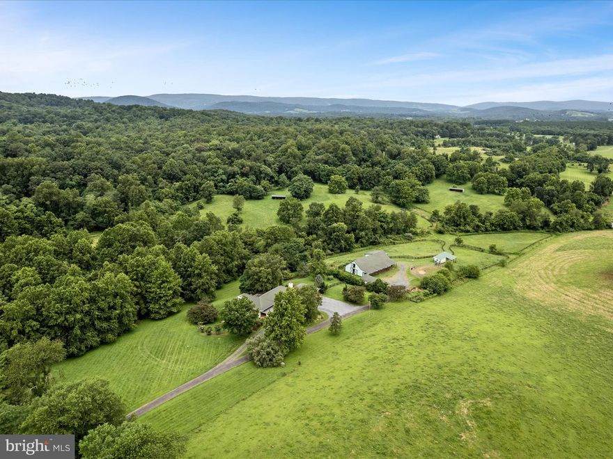 LOOKING for a 53 ac Horse Farm in Delaplane w/income generating barn apt? Welcome home! 
This gorgeous custom built contemporary home features  an OPEN floorplan concept, 4200+sq ft, 3 bedrooms, 2.5 baths,  cherry hardwood floors, gourmet kitchen complete w/amazing cabinetry, top of the line appliances & a massive butlers pantry! As you enter the home via the double front doors you will find a grand foyer that leads straight to the light filled living/dining room (with deck) that boasts an impressive 22-ton "double-sided",  stone wood-burning fireplace. The other side of the fireplace leads you to your home office/family room w/views of the front pasture & featuring high-speed Starlink® internet for telework! To the right of the foyer you will find the huge laundry room & the massive first floor primary owner suite, w/sitting area & outside access to an amazing porch overlooking all the splender of Virginia's local wildlife Fox, Deer, wild Turkey, & a  bird watchers dream!).  The indoor/walkout level offers 10-foot ceilings,  two spacious bedrooms, a full bath, tile flooring & amazing light filled rooms. There is an attached oversized 3 car garage with a must have DOG shower, automatic garage doors, central vacuum, & vast storage. 

FARM details -  52.86 acres of useable land/lush grass pastures, a 10 stall center aisle concrete barn w/dutch doors & overhangs (right side stalls have run outs), hot/ cold  water, heated tack room w/washer and dryer, hayloft, electricity to each stall, JUMP field (front of farm),  seven HUGE three board fenced grass pastures all include auto-waterers, 2 loafing sheds/run ins, round pen w/footing, 2 large storage buildings, trails on and off farm, separate meter/septic, & several creeks.  Perfect for any equestrian operation, has been used as an Equine Quarantine facility due to close proximity to airports,  sustainable AG enthusiast, or Vineyard (underground River/Creeks), or private Estate. Currently not in a conservation easement & an additional dwelling could be built on the farm (per county approval). Farm is currently operating as a 501C with huge tax benefits. 

LOCATION LOCATION- Easy access for DC commuters via 66, Local wineries, medical services, THREE local Foxhunting Clubs nearby, Middleburg 20 min, 15 min to downtown Marshall w/fine dining/farm to table butcher/farmer market/Piedmont Equine/Tri County Feed, Upperville Horse Show 10min, Morven Park & Leesburg 40 min.

OWNER FINANCING IS AVAILABLE to approved buyers.