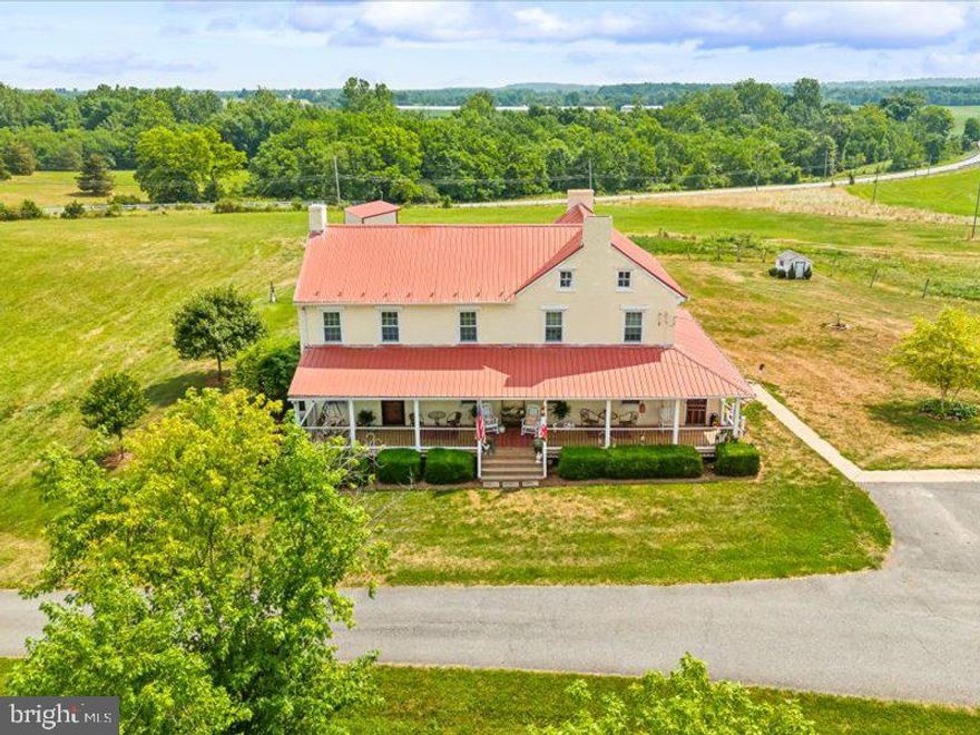 MOTIVATED SELLER!!! Welcome home to this beautiful 1900 farmhouse situated on 25 soaring acres with breath taking views!! Completely renovated and very well cared for over the years! Everything you need is right here! Tons of updates have been provided, some include new windows, newer hvac, tin roof replaced in 2005, new front porch, recently replaced well pump and added uv light. A beautiful 740 sq ft addition recently added, currently used as a living room/living space but could be used as an in-law suite,  or primary suite the possibilities are endless! Beautiful hard wood floors throughout! Gorgeous in ground pool for those hot summer days! Lets not forget all the brand new out buildings which include a 60x40 Shop, 100x80, and a 50x40! Tons of space for all your equipment, cattle, horses and chickens! Close to all commuter routes! This property is truly one of a kind that you don't want to miss! Schedule your showing today!