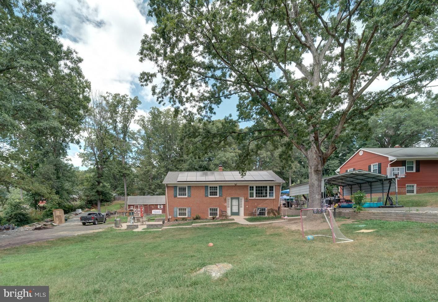 Discover this charming home in Fredericksburg, VA, situated on a generous 0.86-acre lot. With 6 bedrooms and 2 full bathrooms, it’s perfect for families seeking space and comfort.
Enter through a welcoming foyer that leads to a roomy living area featuring elegant hardwood floors.
The contemporary kitchen comes with premium appliances and a dining nook, perfect for family gatherings. On the main floor, you’ll find 3 bedrooms, each boasting large windows and built-in closets, along with a conveniently located full bathroom.
The fully updated basement offers 3 bedrooms, a full bathroom, and a kitchenette, making it ideal for guests or entertaining. This property is conveniently located near various shops and services, providing easy access to everything you need. The exterior showcases a well-maintained garden and patio, perfect for enjoying the beautiful Fredericksburg scenery.