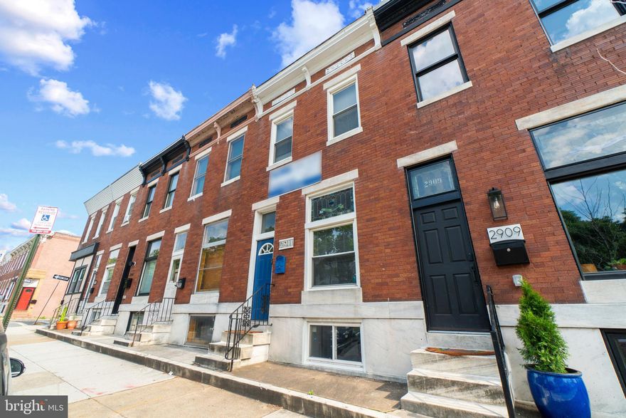 Welcome to 2911 Eastern Ave in the heart of Baltimore's lively Canton area. This park facing, three story all brick row home is impeccably maintained and thoughtfully updated with modern touches throughout while preserving the home's historic charm. The main level boasts gleaming hardwoods, a spacious and bright living room, proper dining area and massive kitchen with stainless steel appliances, new subway tile backsplash and a rear entrance that walks out to a covered back porch and private parking pad. The upper level has three spacious bedrooms and recently renovated full bath. From the back bedroom you can access the newly built (2020) roof deck and take in spectacular panoramic views of the city and greenery of Patterson Park. The lower level contains a cozy den, a vast fourth bedroom with brand new carpet (2023), full bathroom, laundry room with plenty of storage space. The whole home has been freshly painted and is completely move in ready! This home truly has every amenity one could want for in a classic Canton row home & more: proximity to Patterson Park, private parking spot, new roof deck, stylishly updated, a true fourth bedroom plus plenty of storage! Hurry!