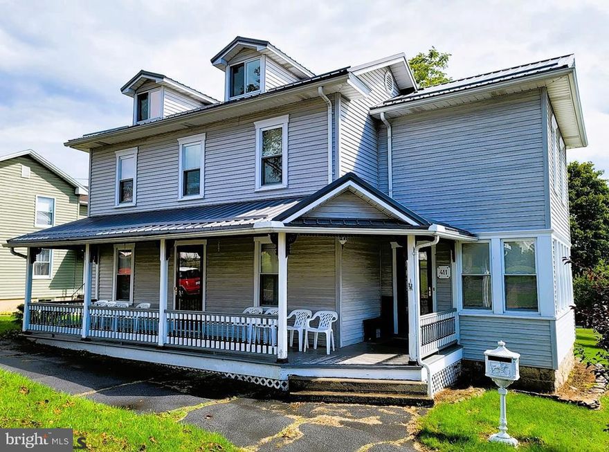The exterior of the property features, metal roof with dormers, upgraded windows, vinyl siding, large 226 sq' covered front porch and a small second story balcony overlooking the back yard. Main entrance leads into a spacious sunroom featuring large baseboards, ceiling fan and numerous windows set in two continuous window seals. Natural lighting and radiant heat provide the perfect environment for plant enthusiasts and space for year-round entertainment. Pasing through the 10 pane French doors brings you to an ample dining area. Your eyes will flow to the spindle stairway leading to the second floor resting forward left. To the right a nice size kitchen that is begging for an Island. Your first view of the kitchen is through a kitchen pass through window. Great for a breakfast bar or buffet area. Kitchen equipped with Refrigerator, dish washer, stove/oven and above counter microwave. You get counter & cabinet space with an easy to maintain manufactured flooring that leads to the Mud/Laundry, and first floor bath.  Next stop Living room. Large room with natural lighting, radiant heat and a shrinking rectangle wooden floor design, featuring an ascending chevron center. Up the stairway to the second floor. Find here, four nicely sized bedrooms with, in my opinion, more than the normal amount of closet space, then I have seen in this period construction type. Rooms have large radiant heat sources. Six panel wood doors, large floor moldings and decent closet space. Walk up attic.