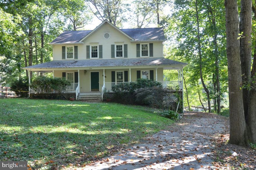 Large and very spacious waterfront home in the development of Hidden Lake in Stafford. You can sit on your front porch and sip coffee and listen to the birds chirp. This home features a open floor plan on the main level  with a large kitchen with wood burning stove, granite counters and walk-out to the spacious deck for summer BBQ's. Formal dining area and living room/family room. Main level laundry and powder room. Upper level features 3 additional bedrooms and full bath along with the spacious primary bedroom with large walk in closet and spacious primary bath with soaking tub, separate shower and double sinks. The main and upper level of the home has beautiful hardwood floors throughout. The home does have an unfinished basement to make your own. HOA is optional, no resale package. Amenities of Hidden Lake are Canoe/Kayak, Fishing allowed,  and swimming at the public beach. Home is close to shopping centers, schools, commuter routes, major highways and Quantico Marine Corps Base. This property *MAY* qualify for seller financing (VENDEE).  If the property was built prior to 1978, Lead-Based Paint may Potentially Exists.