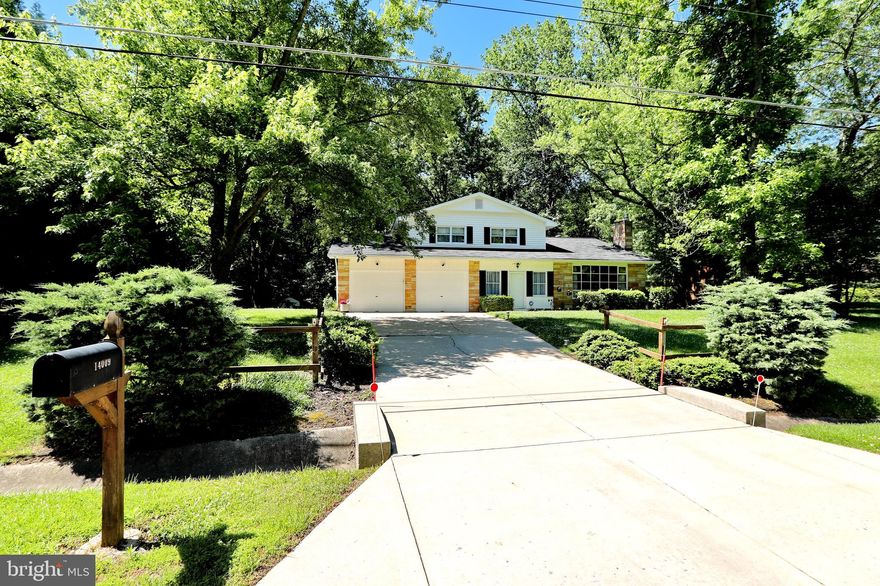 Welcome Home to Manchester.  Owners have taken such love in pride in raising their family with so many wonderful memories they cherish.  Please take a view of the Virtual 3-D Tour:  https://my.matterport.com/show/?m=nK8oA6QNpg7&brand=0 You and your family will love the spaciousness that this home has to offer.  The main level offers a large Family Room with a Den or possible bedroom off side of house with a separate entrance and cute covered patio area.  A grand Living Room and Dining Room area for wonderful family gatherings, take a look at the  beautiful hardwood floors.  The kitchen offers plenty of cabinets space, double ovens and room for morning breakfast to eat in.  The deck is conveniently off the kitchen, freshly painted and ready for the next barbecue.  The upper level offers three large bedrooms, all new paint and hardwood floors.  The Master bedroom provides a primping  area with a lovely vanity.  The hall bath has been completely remodeled.  And yes, there is a Bar/Rec. Room  in the basement for fun evenings with built in shelves.  The basement also offers a full bath.   The large private yard will excite your family.  There is a creek and plenty of shade in the back yard.  A large patio off the family room and under the deck will provide so many areas for entertaining. Plenty of storage and room to grow!The oversized garage offers a workshop area and plenty of cabinet space for storage.  All floors are ceramic and hardwood.  Home Warranty offered!