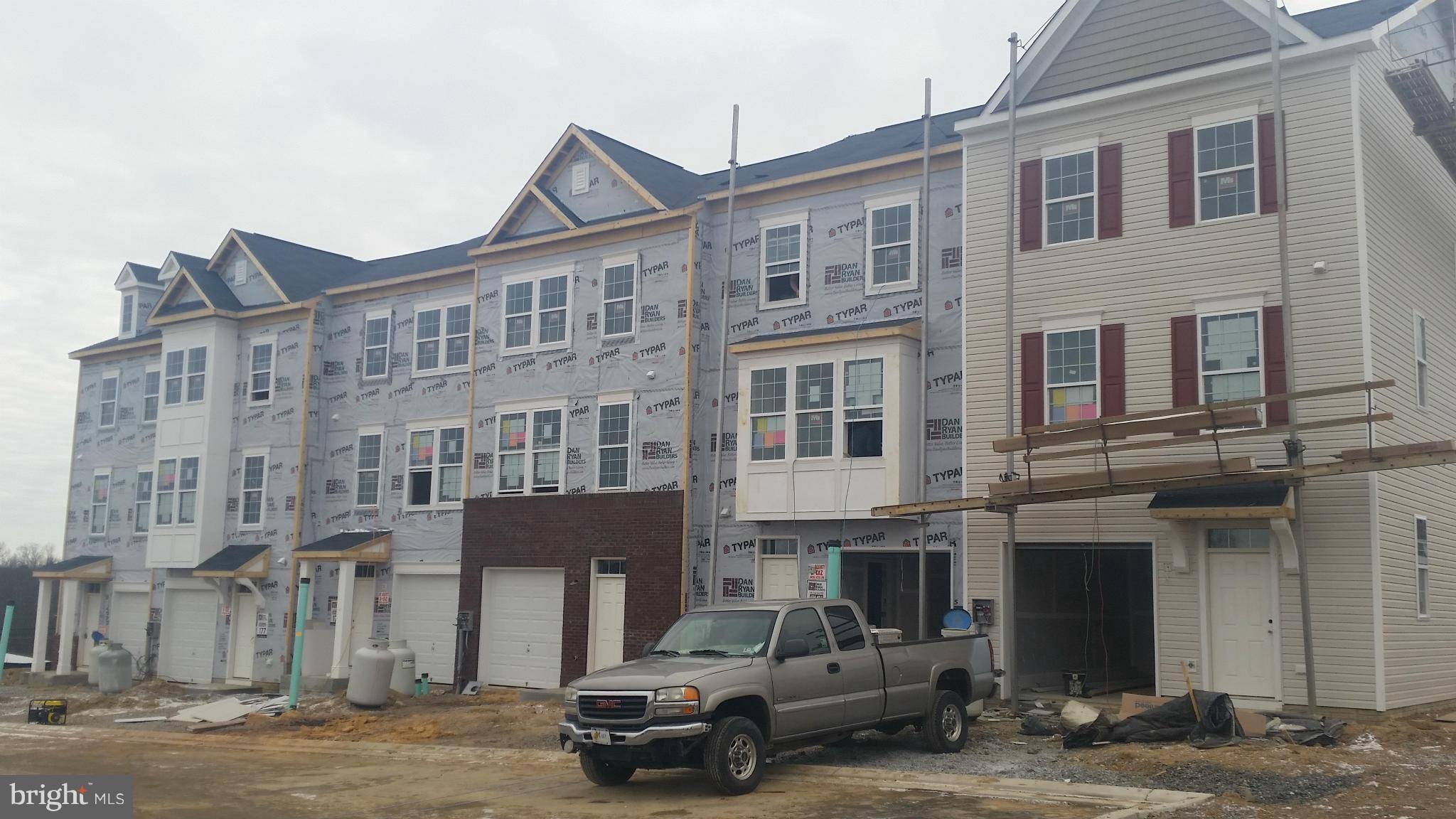 FREE FINISHED REC ROOM! Dan Ryan Builders new Yorktown II garage townhome selling now! 2x6 construction for energy savings! Early 2015 delivery. Open 8' Sunroom plan expanded on 3levels! Deluxe master bathroom, 9'ceilings, 3rd level laundry, upgrade island kitchen, living room breakfast bar, 3piece rough-in on first floor. Find out if you qualify for 100% financing and closing costs today!!