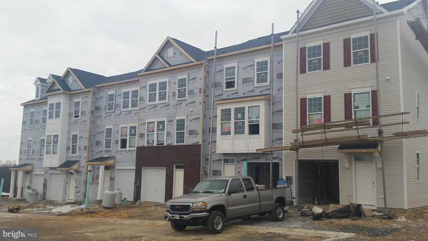 FREE FINISHED REC ROOM! Dan Ryan Builders new Yorktown II garage townhome selling now!  2x6 construction for energy savings! Early 2015 delivery. Open 8' Sunroom plan expanded on 3levels! Deluxe master bathroom, 9'ceilings, 3rd level laundry, upgrade island kitchen, living room breakfast bar, 3piece rough-in on first floor. Find out if you qualify for 100% financing and closing costs today!!