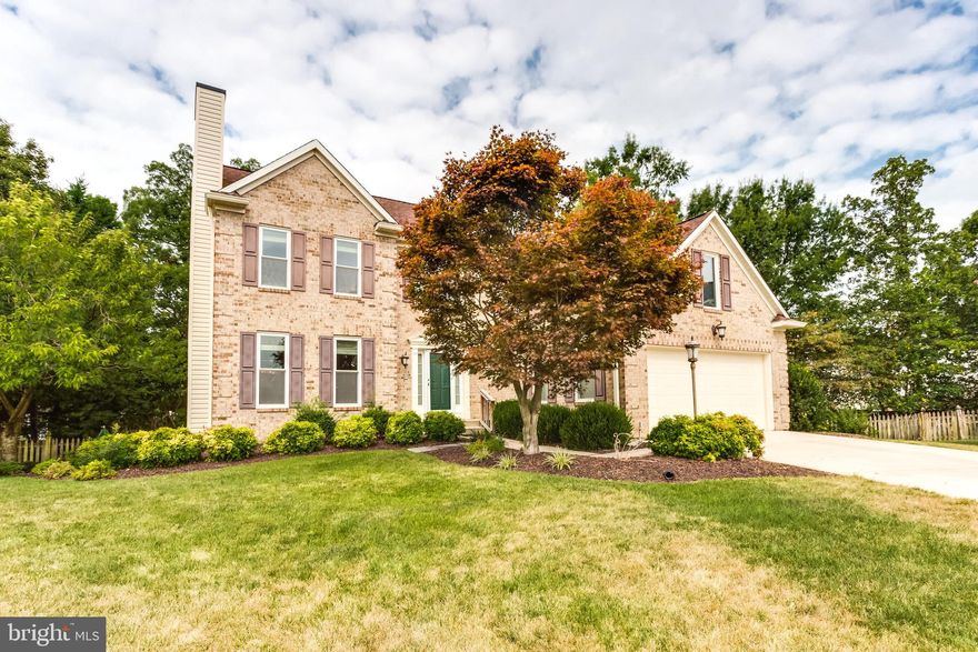 Peacefully located in a tranquil fenced yard setting at the end of a quiet cul de sac this beautiful Two-Story home features a dramatic soaring 2 story foyer. It has large rooms throughout with gleaming Brazilian cherry hardwood flooring all through entire main level, and a main level room that could be an office or 5th bedroom. Upper level hallway that is open to foyer has hardwood floors as well. There are 4 BR s on upper level and many updates and upgrades throughout this beautiful home. So many features are offered   Brazilian Cherry Hardwood flooring, Gourmet kitchen with granite countertops, stainless steel appliances, formal and spacious living and dining rooms, as well as a main level family room with clean gas fireplace. There is a laundry room on upper bedroom level, so you don t have to travel downstairs carrying laundry! Also, a luxurious master suite with hardwood floors and vaulted ceiling and includes huge walk-in closet with custom organizers as well as the en-suite master bathroom with a spa-like huge ceramic tile walk-in shower and two separate sinks and custom cabinetry. There are 3 1/2 bathrooms in all.  Expansive Recreation room/entertainment space in basement with hardwood flooring and a second fireplace, also includes a wet bar, built in wine rack and full bathroom, and 2 other rooms that could be playrooms or den/office area or media room. A beautiful large private rear deck, outdoor shed, gorgeous landscaping complete this home.  This property has been meticulously cared for and well maintained. It s an easy commute to Washington DC, The National Harbor, Joint Base Andrews and points South. It s conveniently located along Route 228 and the major corridors   Rt. 210, 301, the new McDaniel Rd extension, as well as commuter lots to DC. This one has it all! Your new home awaits you in this sought-after Ashford Oaks community!