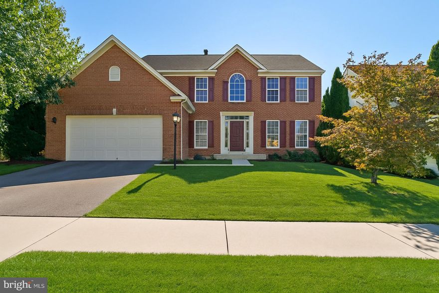 Open House -Sunday 10/26 11-1. Great Value and your opportunity to own in a desirable upscale community in Washington County! This brick-front, 2-car garage, 4-bedroom 2/2 bath light-filled colonial with finished basement has lots of nice touches throughout; including gas fireplace, tiled morning room off the kitchen with vaulted ceiling. French doors lead off the sunroom to a maintenance-free Trex deck.  The kitchen is loaded with plenty of cabinets, lots of recessed lights, a large center island, brand new  uba tuba granite counters, desk station, and tile floor! The living and dining rooms are accented witb crown molding and chair rail and both outfitted to serve multiple purposes. The 2-story foyer is nicely appointed with hardwood floors as is the half bath on the main level. Upstairs layout has 4 nice sized bedrooms with the primary bedroom accessible through double French doors large enough to fit any size furniture with a huge walk-in closet and primary bath with dual vanities, title floor, a soaking garden tub and separate stand-up shower.  The bonus feature to this property is the massive finished walk-up basement space with half bath perfect for a game room or whatever your heart desires.  Located in the desirable amenity-rich Hagers Crossing community, you’ll enjoy access to a pool, walking trails, playgrounds, nearby schools, shopping, restaurants, and easy access to major highways. Recent updates include brand new granite counters in the kitchen (2025), hot water heater (2025) and dual zone HVAC (both replaced in 2020). Some pictures have been virtually staged.