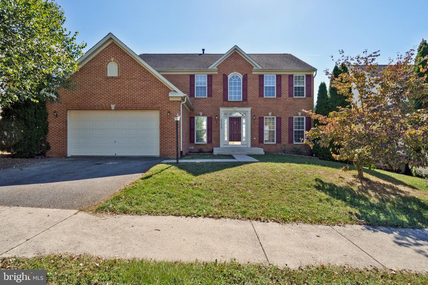 Open House -Sunday 10/26 11-1. Great Value and your opportunity to own in a desirable upscale community in Washington County! This brick-front, 2-car garage, 4-bedroom 2/2 bath light-filled colonial with finished basement has lots of nice touches throughout; including gas fireplace, tiled morning room off the kitchen with vaulted ceiling. French doors lead off the sunroom to a maintenance-free Trex deck.  The kitchen is loaded with plenty of cabinets, lots of recessed lights, a large center island, brand new  uba tuba granite counters, desk station, and tile floor! The living and dining rooms are accented witb crown molding and chair rail and both outfitted to serve multiple purposes. The 2-story foyer is nicely appointed with hardwood floors as is the half bath on the main level. Upstairs layout has 4 nice sized bedrooms with the primary bedroom accessible through double French doors large enough to fit any size furniture with a huge walk-in closet and primary bath with dual vanities, title floor, a soaking garden tub and separate stand-up shower.  The bonus feature to this property is the massive finished walk-up basement space with half bath perfect for a game room or whatever your heart desires.  Located in the desirable amenity-rich Hagers Crossing community, you’ll enjoy access to a pool, walking trails, playgrounds, nearby schools, shopping, restaurants, and easy access to major highways. Recent updates include brand new granite counters in the kitchen (2025), hot water heater (2025) and dual zone HVAC (both replaced in 2020).