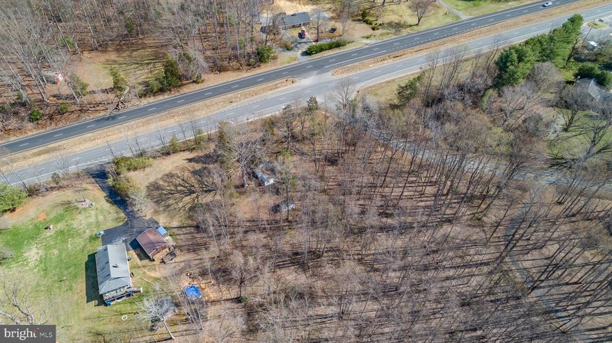 4 Acres of A2 zoned land with over 200 feet of frontage on Warrenton Road. 3 bedroom 1 bath frame bungalow on property is in shell condition and able to be rehabbed or razed. Current zoning allows property to be used for agricultural, residential and some commercial uses by right such as a place of worship, home daycare, school, home occupations, etc. A2 zoning also allows subdivision of property into 1 acre homesites by right. Warrenton Road location and frontage also allows for potential of parcel to be up zoned and redeveloped for more commercial uses.
