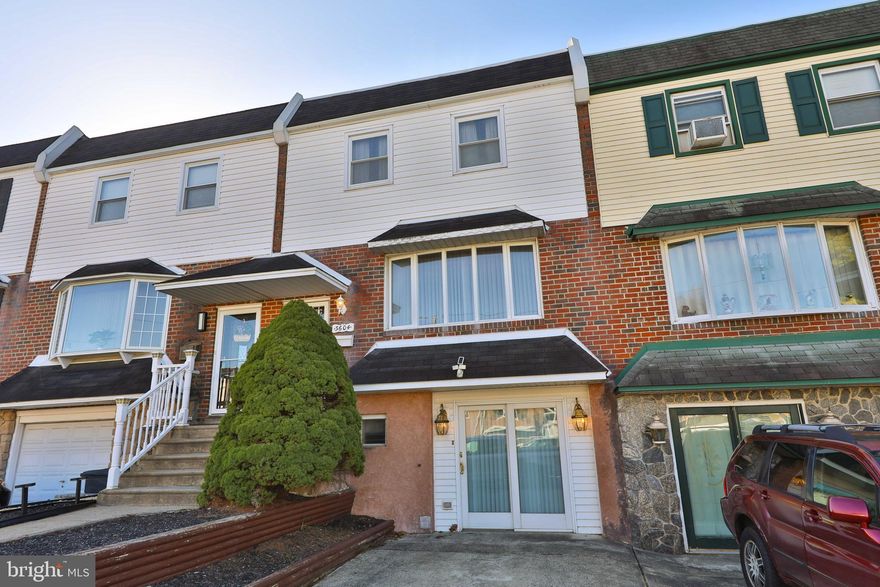 Charming Morrell Park Straight-Thru with Sunroom & Expanded Basement!
Welcome to this well-maintained 3-bedroom, 1.5-bath straight-thru row home in the desirable Morrell Park neighborhood. The bright living room features a bow window, leading to a formal dining room and an updated eat-in kitchen with ceramic tile flooring, white cabinetry, a gas range, dishwasher, corner sink, and French doors opening to an unheated sunroom addition complete with a skylights, ceiling fan, and another bow window.
Upstairs, you'll find three spacious bedrooms, all with ceiling fans, and a ceramic tile hall bath. The main bedroom boasts a walk-in closet with custom organizers for added convenience.
The expanded walk-out basement (formerly the garage) serves as a versatile family room with a powder room, laundry area, and direct access to the level backyard and covered patio—perfect for outdoor enjoyment. A private driveway provides off-street parking. Additional highlights include central air conditioning for year-round comfort.