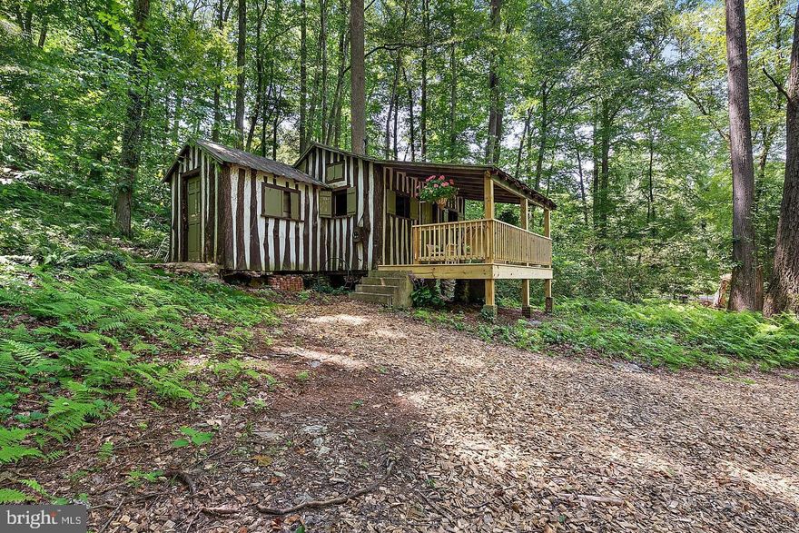 TUCQUAN, the jewel of southern Lancaster County! 1.7 pristine woodland acres at the corner of Tucquan Glen & Pencroft Rds & Tucquan Creek runs through it with 76 acres of preserved farmland adjacent. This is an outstanding opportunity. There is a rustic, storybook 1 BR cabin w/a recently rebuilt covered porch overlooking the newly decked steel footbridge that crosses the creek to a grassy area suitable for a garden or even volley ball. There is a new drilled well. The hillside is wooded with hemlock, beech, birch, locust, poplar & hornbeam plus groves of various ferns that Tucquan is renowned. The Conservancy is close by with its many miles of hiking trails. Also nearby is the boat launch at Lake Aldred on the Susquehanna & Muddy Run Park. This private paradise could be a retreat or an outstanding building lot with a guest/party house. Only 16% of land in Lancaster Co is forested; you could be in the forest on this special property! See also MLS 1002070228