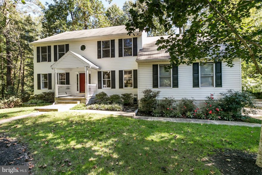 IMMACULATE colonial on premium, .47 ac, fenced lot in water privileged community! Wooded privacy! Numerous upgrs! Hdwd flrs! New A/C! Renovated KT w/large granite island, cer tile flrs! 1st flr library! Lg LR w/french drs! Sep DR w/bay window! FR w/pellet stove & sliders to custom deck! Huge Mstr bdrm! Mstr bath w/soaking tub/sep shower! Large bdrms! Light & air airy!