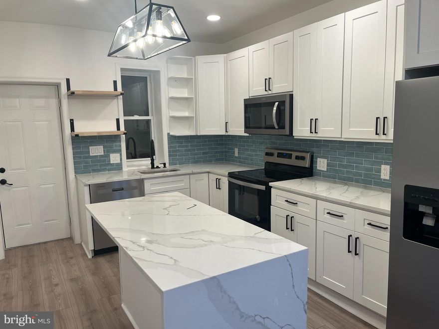 Approved by the Zoning Board of Adjustment on 12/10 for duplex use, 3017 W Susquehanna Avenue is a fully renovated 5-bedroom, 3-bath property delivered with an approved building permit that only needs a contractor assigned to complete the final steps of the duplex conversion. The home is currently configured as a single-family residence, and the remaining work required to establish the two-unit layout is minimal and straightforward.

The first-floor unit will offer a bright 2-bedroom, 1-bath layout with modern finishes, direct access to a private fenced backyard, and a huge dry full-height basement ideal for storage, a workshop, or additional value-add potential. The upper bi-level unit will include 3 bedrooms and 2 bathrooms across the second and third floors, highlighted by a top-floor primary suite with a walk-in closet, flex office or dressing area, and a spa-inspired bath with a soaking tub and oversized shower.

The property features updated systems, a modern kitchen with stainless-steel appliances and quartz countertops, renovated bathrooms, and spacious living areas. Off-street parking adds everyday convenience.

With duplex zoning fully approved, the building permit in place, and nearly all renovation work complete, this property offers substantial upside for investors or owner-occupants looking to finalize a high-performing two-unit asset. A 10-year Philadelphia tax abatement, along with exceptionally low 2025 taxes of just $540, further enhances long-term value in this rapidly growing neighborhood.