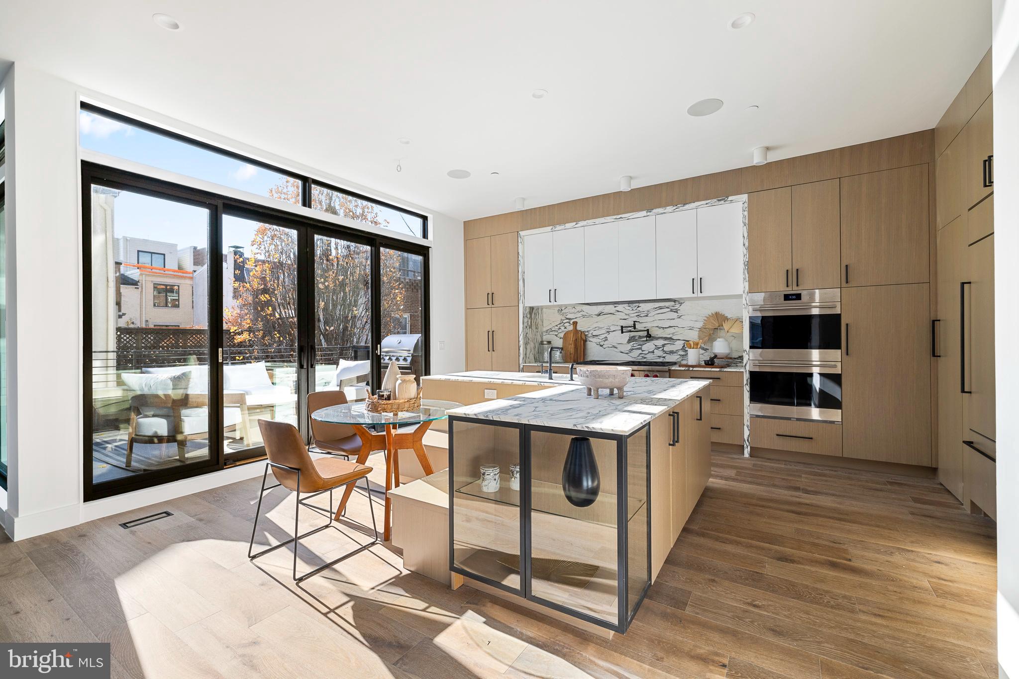 Discover an unparalleled realm of refined living at 502 S 21st St, an exquisite sanctuary nestled in the surrounding area of Philadelphia's coveted Rittenhouse Square. A harmonious
blend of tranquility and originality awaits within this architectural marvel, standing tall with a remarkable 33-foot width and an impressive 42-foot height.
Nestled on a serene tree-lined block, this residence graces a dual corner lot, an urban oasis amidst the vibrant energy of the city. Enter through two convenient pathways; the grand foyer of the main entrance leads to a luxurious guest suite complete with a full bathroom, while the attached two-car garage offers seamless access to a well-appointed laundry room and a functional mudroom, effortlessly harmonizing daily life with ease.
Ascend via the grand five-stop elevator to the second floor, where an expansive open layout awaits. The formal dining area adjoins the living space, seamlessly connected to an expansive terrace through oversized Pella sliding glass doors. A bespoke Arabescato Vagli Marble gas fireplace emanates warmth, accentuating the approximate 10-foot ceilings and vast windows that flood the space with natural light and captivating vistas.
Step onto the inviting terrace, an idyllic outdoor haven with a grill station, perfect for hosting intimate gatherings and entertaining guests. The gourmet chef's kitchen boasts top-of-the-line Wolf and Sub Zero appliances, a wine and beverage refrigerator, dual wall ovens, a 48" cooktop, and a concealed pantry—marrying functionality with opulence effortlessly.
Journey to the third level, where the formal primary suite awaits, a luxurious retreat featuring oversized walk-in closets, a wet bar with a refrigerator, and an additional versatile space for a den, office, or supplementary closet space - limited only by imagination. The primary bath exudes spa-like luxury, adorned with dual oversized Calacatta gold marble vanities, LED mirrors, full wall Porcelanosa tiling and smart toilets with bidets.
The fourth level unveils two bedrooms, two full bathrooms, and an additional powder room. Ascend further to the full-level roof deck, a panoramic vantage point boasting breathtaking vistas of both Philadelphia's sunrise and sunset. Completing this estate, the fully finished basements offer an inviting media center, wet bar, and an extra bedroom with a full bathroom.
Welcome home to a life of peaceful elegance, schedule a private tour today to experience a new style of city living at The Residences at 2100 Lombard Street.