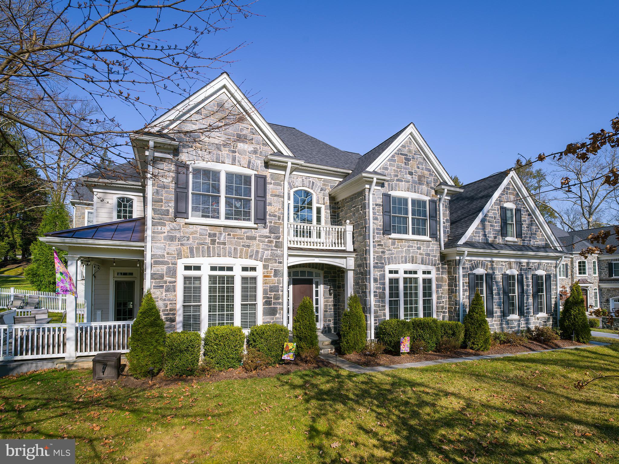 1241 Morris Road is a gorgeous stone colonial located in a historic Wynnewood neighborhood, close to many stores, restaurants, and a short walk to the Wynnewood train station. Built in 2016, this home features five bedrooms, four and a half bathrooms, a 3 car-attached garage, and a fenced backyard. This home offers a lot of space to grow.
When you enter the front door, you are greeted with an open and inviting foyer that displays the beautiful, curved staircase. Hardwood floors are found throughout the first floor creating a nice flow from room to room. To the left of the foyer, you will find glass French doors that open to an office with windows with transoms above that brighten and warm up the space. Continuing through the room leads to another set of French doors that open to the family room. The family room is spacious and features a wood burning fireplace and a door leading outside to the patio and fenced in backyard. The open floor plan flows into the breakfast room that features bay windows that create a lot of space to enjoy meals with loved ones. Attached is the kitchen with sleek white cabinets, black granite countertops, and stainless-steel appliances. The appliances include a Whirlpool refrigerator, a Bosch dishwasher, a Viking cooktop, built-in convection oven and microwave. Sonos systems are found throughout the entirety of the home, making for a fun and convenient feature to listen to music in every room. The kitchen offers access to the attached 3 car garage and a mudroom. Continuing through the flow of the main floor leads back to the formal dining room off the foyer. This room is great for entertaining guests and features crown molding and large windows that brighten the space. A powder room completes the first floor.
Upstairs you will find four spacious bedrooms, including the wonderful primary bedroom which includes a gas fireplace and a sitting room. This leads to the primary bathroom with a double sink vanity, a large sunken bathtub, a walk-in shower, and a separate toilet area. The primary bedroom is complete with a large walk-in closet. The second bedroom has its own ensuite bathroom, perfect for a guest room. Bedroom number three has a large walk-in closet and shares a shower-tub combination and toilet with the fourth bedroom, jack and jill style. However, both rooms have their own sink vanity.
The lower level was fully finished in 2019. It includes a den for relaxing, a convenient wet bar, an exercise room and plenty of room for storage. The spacious fifth bedroom and a full bathroom are also found on the level. With its wonderful features, lovely floor plan, and prime location, 1241 Morris Road will be a true pleasure for its new owner.