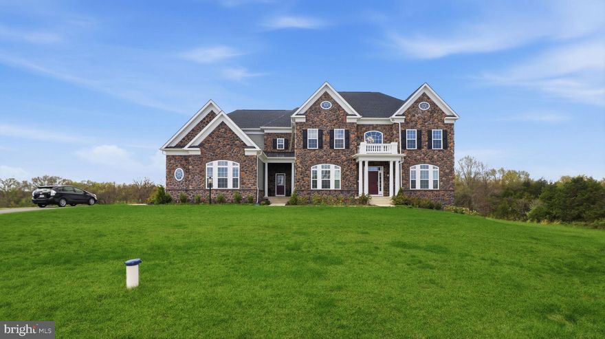 Nestled in the serene landscapes of Nokesville, this exquisite Colonial-style residence offers a unique blend of luxury and comfort, set against a backdrop of sprawling 10.01 acres. Built in 2024, this stunning property showcases a timeless brick front façade that exudes elegance and sophistication, inviting you into a world of refined living. As you step inside, you are greeted by an expansive layout that promises endless possibilities for customization. With a generous total finished area of 5,858 square feet, the interior is a blank canvas, ready for your personal touch. The unfinished walkout basement provides ample space for future expansion, whether you envision a state-of-the-art home theater, a personal gym, or additional living quarters. The potential is limitless, allowing you to create the home of your dreams. The heart of this residence is its thoughtfully designed spaces that encourage both relaxation and entertainment. Imagine hosting gatherings in the spacious living areas, where natural light pours in through large windows, illuminating the elegant details throughout. The side-entry attached garage, accommodating two vehicles, adds convenience to your daily routine while maintaining the home's aesthetic appeal. Outside, the expansive grounds offer a private sanctuary, perfect for outdoor enthusiasts or those seeking tranquility. The vast acreage provides ample space for gardening, recreational activities, or simply enjoying the beauty of nature. The peaceful surroundings create an idyllic setting for unwinding after a long day or hosting summer barbecues under the stars. This property is not just a home; it's a lifestyle. Experience the charm of rural living while being just a short drive from the vibrant amenities of nearby towns. Enjoy the best of both worlds-seclusion and accessibility-making it an ideal retreat for those who appreciate the finer things in life. With its luxurious features and exclusive lifestyle, this Nokesville gem is ready to welcome you home. Embrace the opportunity to create a legacy in a residence that promises comfort, elegance, and a lifetime of cherished memories. Don't miss your chance to make this exceptional property your own.