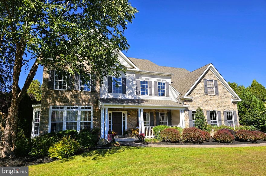 WELCOME HOME... to this Gorgeous 5500+ finished sq ft Colonial with 5 Bedrooms, 2 Full Baths/ 2 Half Baths nestled in the heart of Elkton.   This 1.35 acre property is less than 2 miles from the MD/DE state lines and less than 1 mile from the I-95 exit.   Entering the home through the front door and past the  front porch, you enter with a stunning view of the turned oak dual staircase and oak railing walkway running parallel to the roofline across the center of the home.  A formal dining room is on your right with formal living room on your left.  The majority of the main floor of this home is beautiful hardwood flooring. Walking past the staircase is a powder room on your left sitting next to the roomy office with built in bookshelves.  The dramatic two-story family room is centered around the enormous floor to ceiling stone fireplace which opens up to the gourmet kitchen complete with black stainless-steel appliances, 42" maple kitchen cabinetry and Corian countertops with a center island.  Perfect for summer Bar B Q's or Holiday gatherings, there is plenty of room for everyone.  On warm weather days, an outside deck runs the entire length of the back of the home which overlooks 1.35 acres of open land and woodlands.  There is a separate laundry room with rear exit door, pantry and exit to the 2 car turned garage.  You can enter the second floor using the back staircase also all in oak to not only 4 oversized bedrooms, a full hall bath, a Primary bath ensuite off the primary bedroom with walk in closet but an additional bonus room that could be used for just about anything...  an office, a play room, a computer room, take your pick of options.  The lower-level basement is 85% finished with a huge Recreation room complete with Theater system/screen, wet bar and game/pool table.  There is also an additional bedroom on this level with a half bath and full welled exit for walk out.   Newer roof and Central A/C within 5 years.  This home is centrally located with a quick access to both i-95 and Rt 40, It is about an hour commute to both Philadelphia and/or Baltimore and a two-hour drive to New York City/Washington DC.