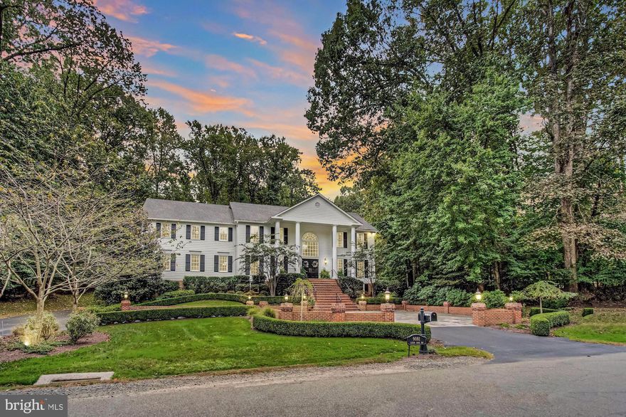 Tucked away in the bucolic Virginia community of Great Falls is Eaton Park, a collection of just a handful of homes along a stunning tree-lined street, immediately adjacent to Riverbend Park.  Channeling the prominent estates of Greenwich, Connecticut and the shores of Long Island, 9081 Eaton Park strikes a careful balance of tastefully refined elegance, without sacrificing any amenity or convenience.  With over 10,000 estimated finished square-feet on a 1.72 acre lot, you will marvel at the privacy provided by the lush landscape and tranquil setting that is this homesite.  Our sellers have extensively invested in upgrades and improvements that will considerably elevate your lifestyle experience in, and outside of this mansion.  Departing the motor-court and ascending into the formal entry foyer, you will immediately admire the thoughtful details that went into the design of this residence.  Formal dining to the left, formal study/library on the right, excitement grows as you enter the chef's kitchen overlooking, and open to, the grand family room.  Also on the main level is the fully renovated formal living room/conservatory, as well an atrium with walls of windows leading to the outdoor living areas, a spa-bath complete with dry sauna, and a guest suite with private bath.  Upstairs on the bedroom level, you will find generously proportioned secondary bedrooms, and an owner's suite that must be seen in person (but we'll attempt to describe it here anyways.)  Dual baths are just one of the many touches that makes this space special, complimented by soaring ceilings, a labyrinth of poshly built-out closets with private laundry, and abundant natural light.  The lower level of the home is simply, for lack of a better term, fun.  Complete with club/pub room with billiards hall, arcade, wine cellar, fitness center, and another guest suite, few other surroundings offer a more comfortable place to take in a book, or a feature film.  After experiencing the interiors, the outdoor living spaces will not disappointment.  The exterior grounds have been carefully curated to offer a tranquil oasis with abundant stone terraces, plazas, and manicured lawns, but also delighting the active with an updated in-ground pool and a resurfaced tennis/sport court.  The covered outdoor kitchen sports top-of-the-line appliances, UV heaters, and an exterior pool bath.This home quite literally has it all, and now it can be yours.  Welcome to 9081 Eaton Park.