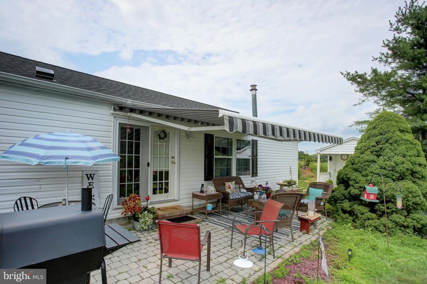 Embrace low-maintenance luxury in this beautifully designed manufactured ranch home, offering 2,128 square feet of spacious living within the vibrant Shippensburg Village 55+ adult community. This 3-bedroom, 2-bath residence blends comfort and style, featuring a bright living room, a cozy family room with a stone gas fireplace, and a dedicated office for work or hobbies. The primary suite is a true retreat, boasting a large walk-in closet and a luxurious bath with a soaking tub, separate shower, and dual-sink vanity. The expansive kitchen, complete with a central island, flows seamlessly into formal and informal dining areas, ideal for entertaining or everyday meals. A separate laundry room adds convenience, while the inviting side patio with an awning and a large shed with a covered porch provide ample outdoor space for relaxation and storage.  The room measurements are an approximate guide, buyers to verify. The monthly community fee of $300 includes your sewer, trash, and with optional lawn and snow care included with your monthly rent for $50 more, you can spend less time on outdoor chores and more time doing what you love. Enjoy the best of 55+ living in this thoughtfully designed home, perfect for your next chapter!